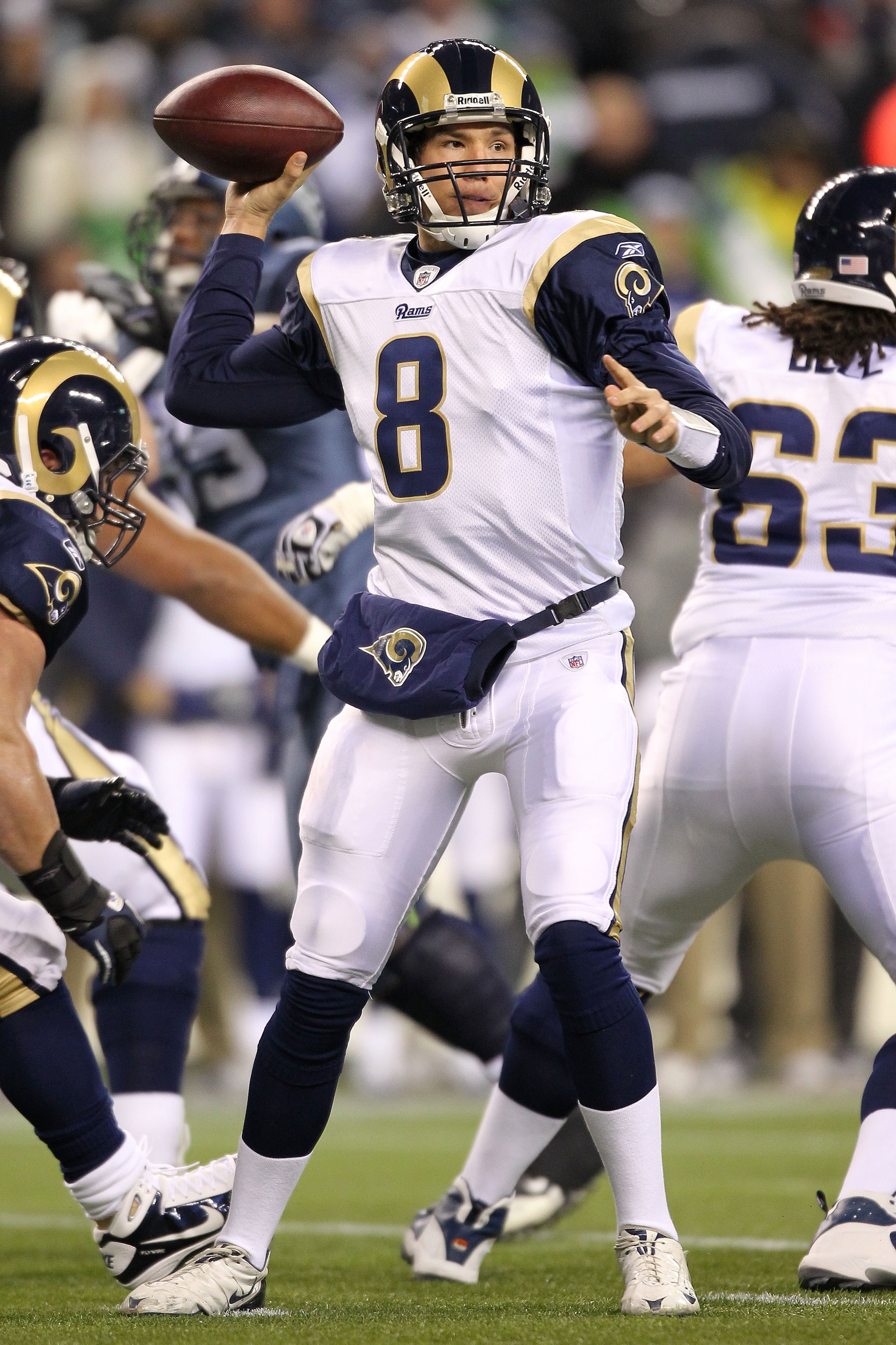 SEATTLE, WA - JANUARY 02:  Quarterback Sam Bradford #8 of the St. Louis Rams looks to pass against the Seattle Seahawks during their game at Qwest Field on January 2, 2011 in Seattle, Washington.  (Photo by Otto Greule Jr/Getty Images)