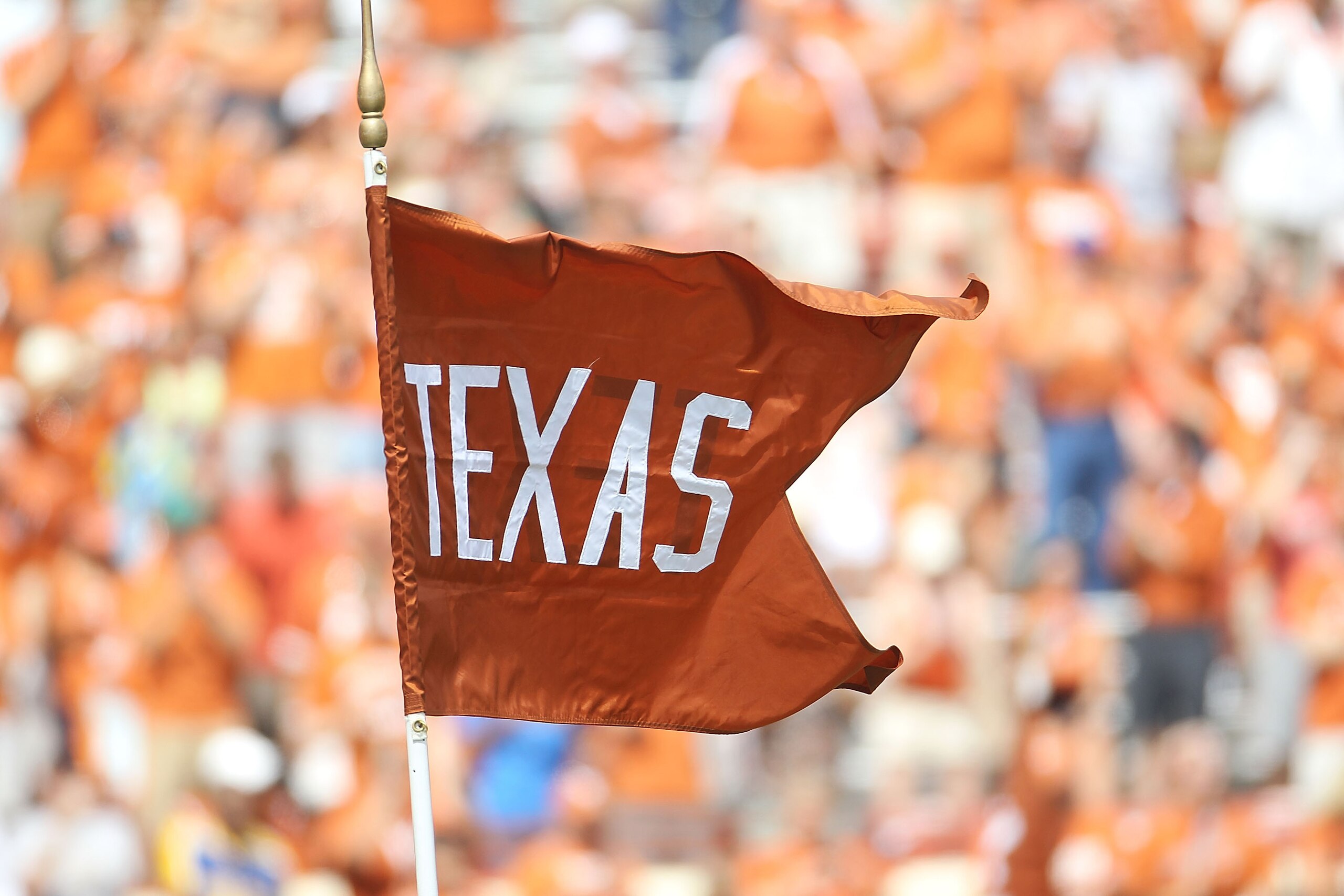 AUSTIN, TX - SEPTEMBER 25: A flag for the Texas Longhorns waves at Darrell K Royal-Texas Memorial Stadium on September 25, 2010 in Austin, Texas. (Photo by Ronald Martinez/Getty Images) AUSTIN, TX - SEPTEMBER 25: A flag for the Texas Longhorns waves at Darrell K Royal-Texas Memorial Stadium on September 25, 2010 in Austin, Texas. (Photo by Ronald Martinez/Getty Images)