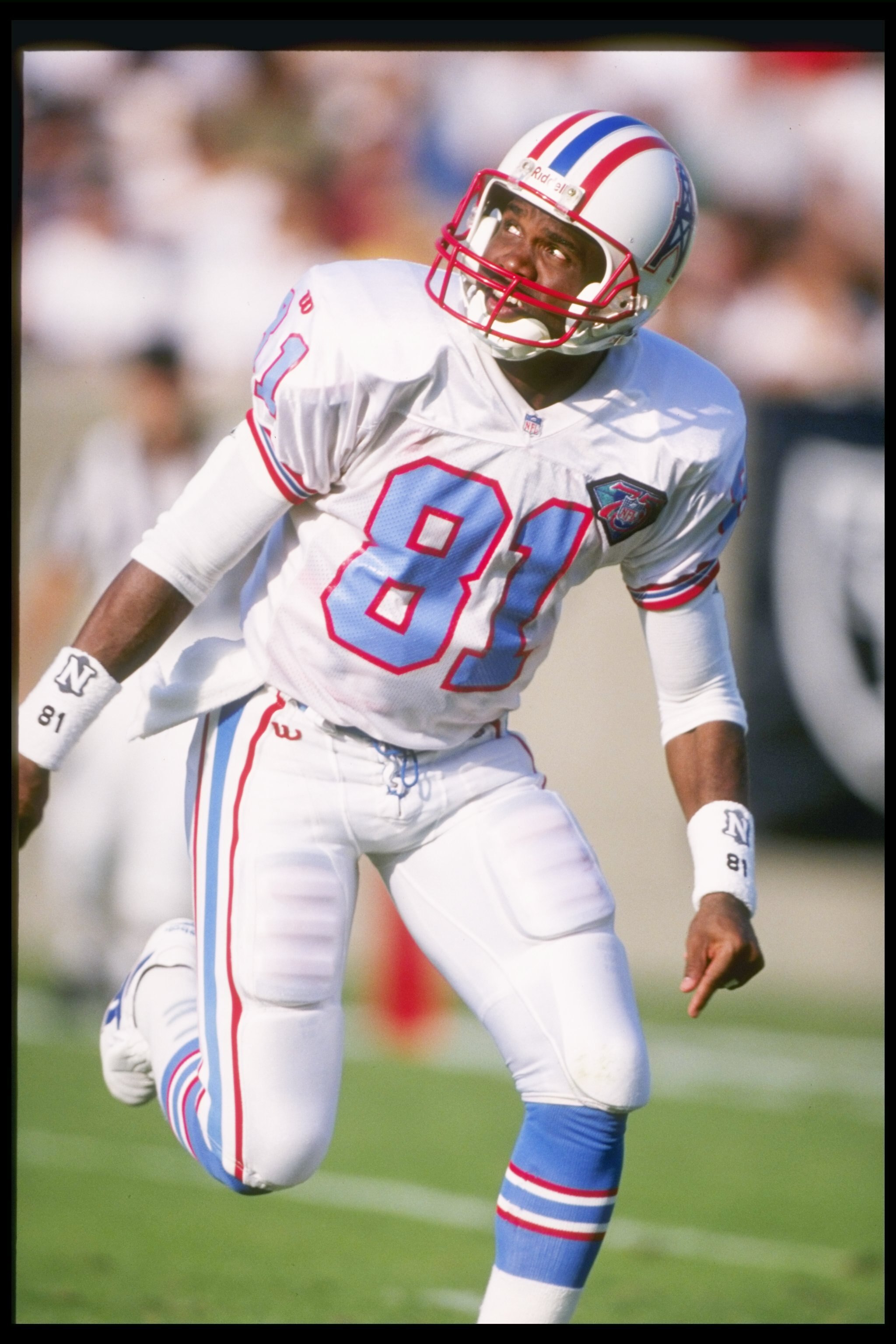 30 Oct 1994:  Houston Oilers wide receiver Ernest Givins looks over his shoulder for a pass during game against the Los Angeles Raiders at Los Angeles Memorial Colesium in Los Angeles, California.  The Raiders won the game 17-14. Mandatory Credit: Al Bell