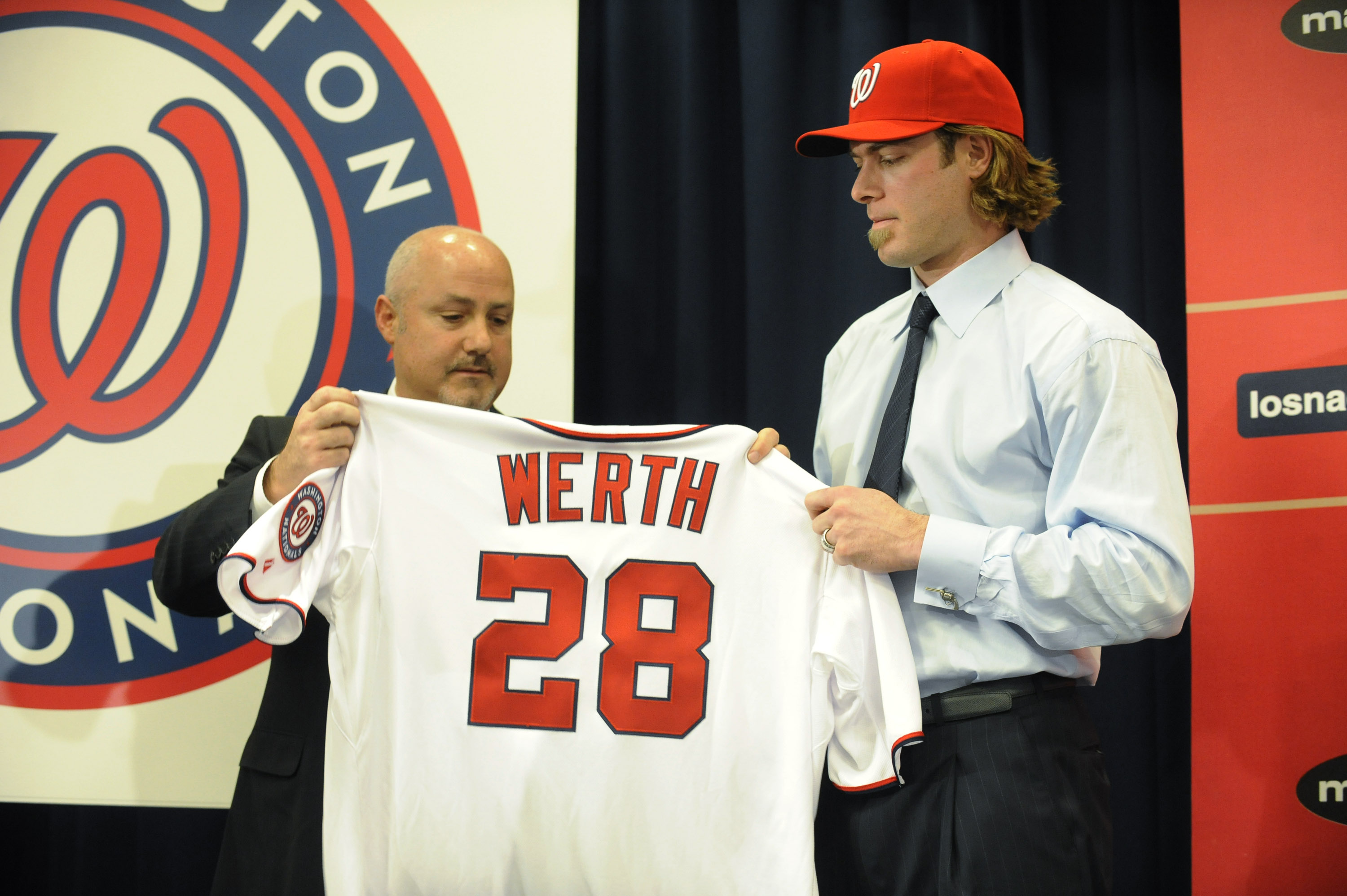 WASHINGTON, DC - DECEMBER 15:  Executive Vice President of Baseball Operations and General Manager Mike Rizzo (L) introduces Jayson Werth #28  to the media on December 15, 2010 at Nationals Park in Washington, DC.   (Photo by Mitchell Layton/Getty Images)