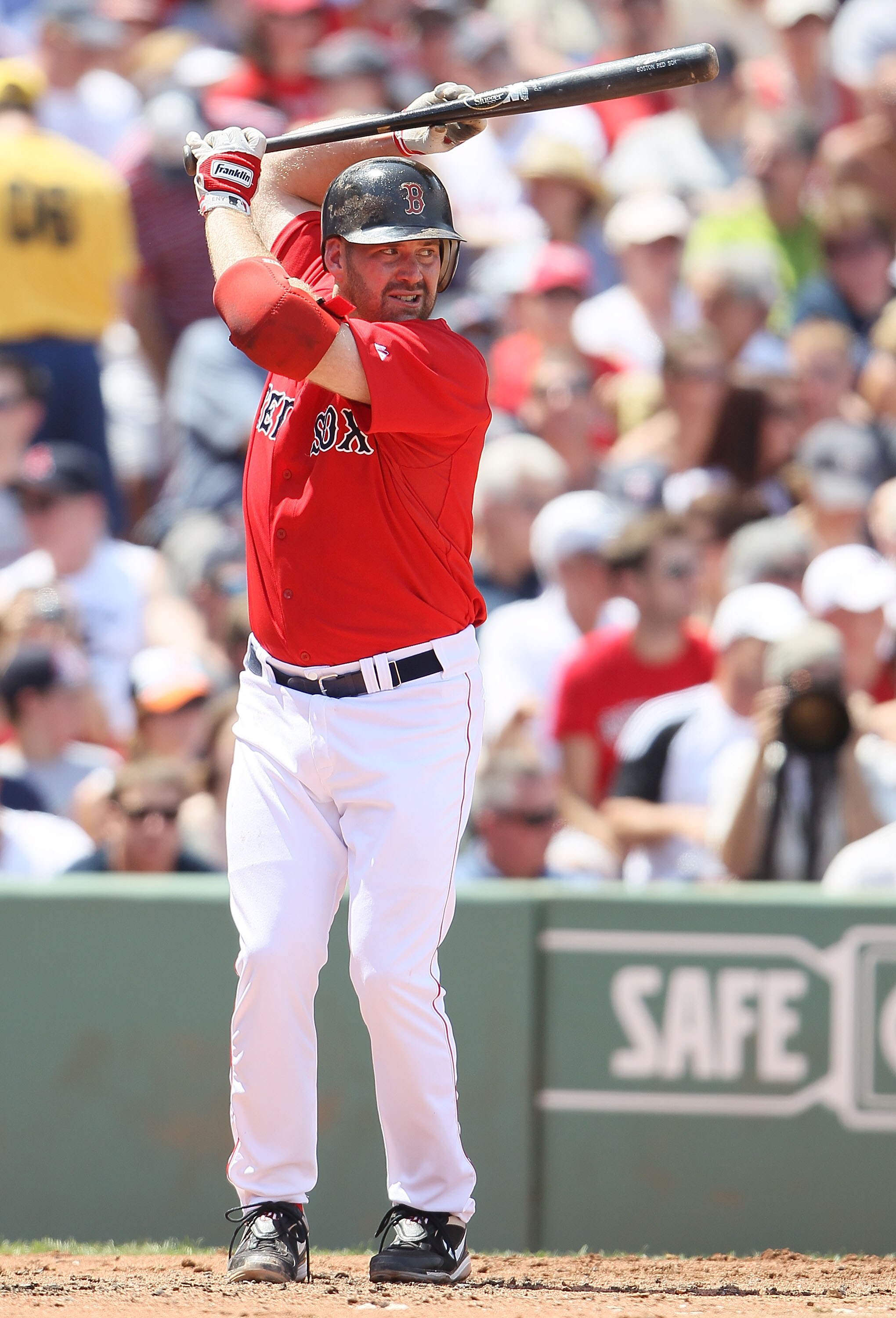 BOSTON - JULY 04:  Kevin Youkilis #20 of the Boston Red Sox waits for his pitch against the Baltimore Orioles on July 4, 2010 at Fenway Park in Boston, Massachusetts.  (Photo by Elsa/Getty Images)