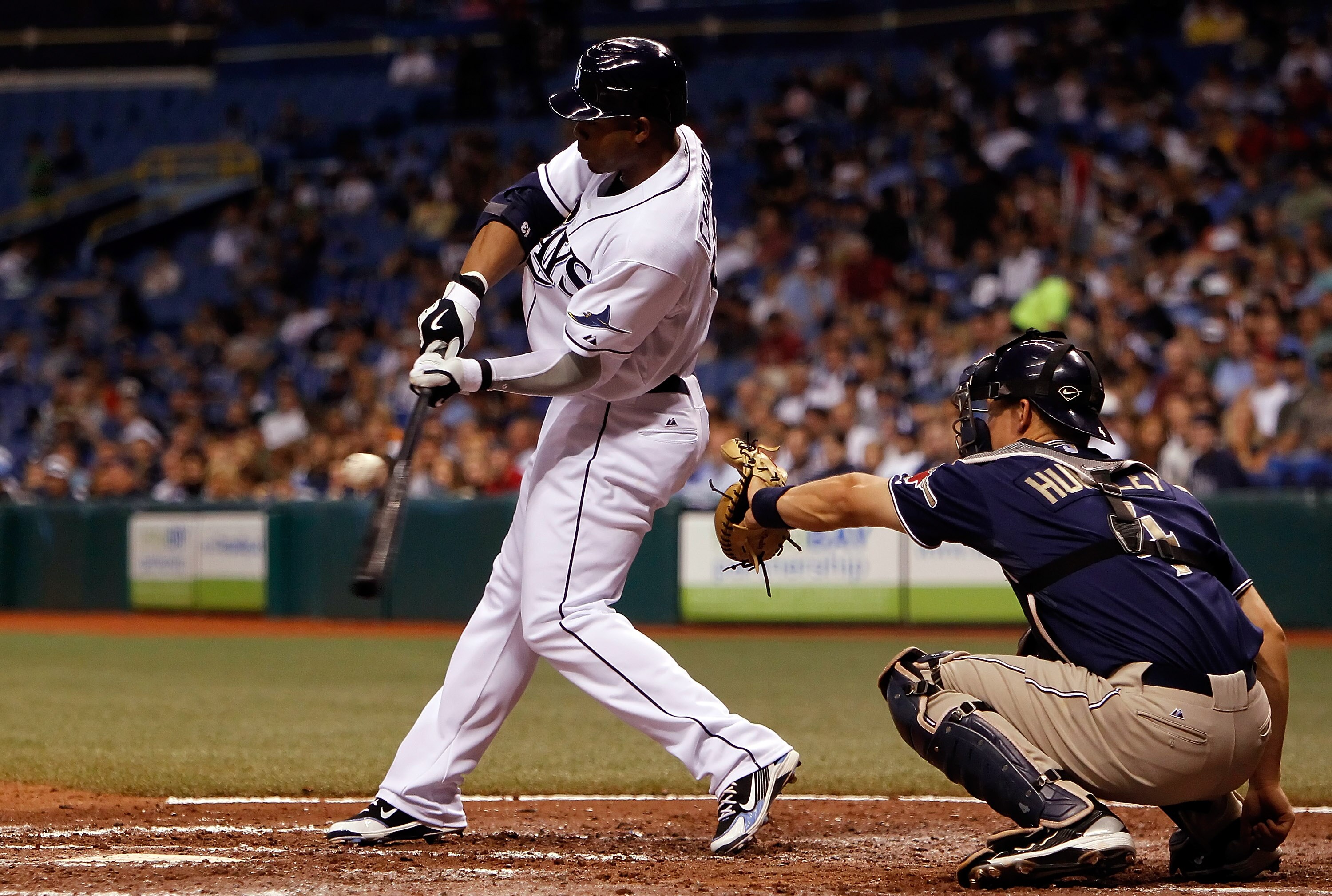 ST. PETERSBURG - JUNE 22:  Outfielder Carl Crawford #13 of the Tampa Bay Rays fouls off a pitch against the San Diego Padres during the game at Tropicana Field on June 22, 2010 in St. Petersburg, Florida.  (Photo by J. Meric/Getty Images)