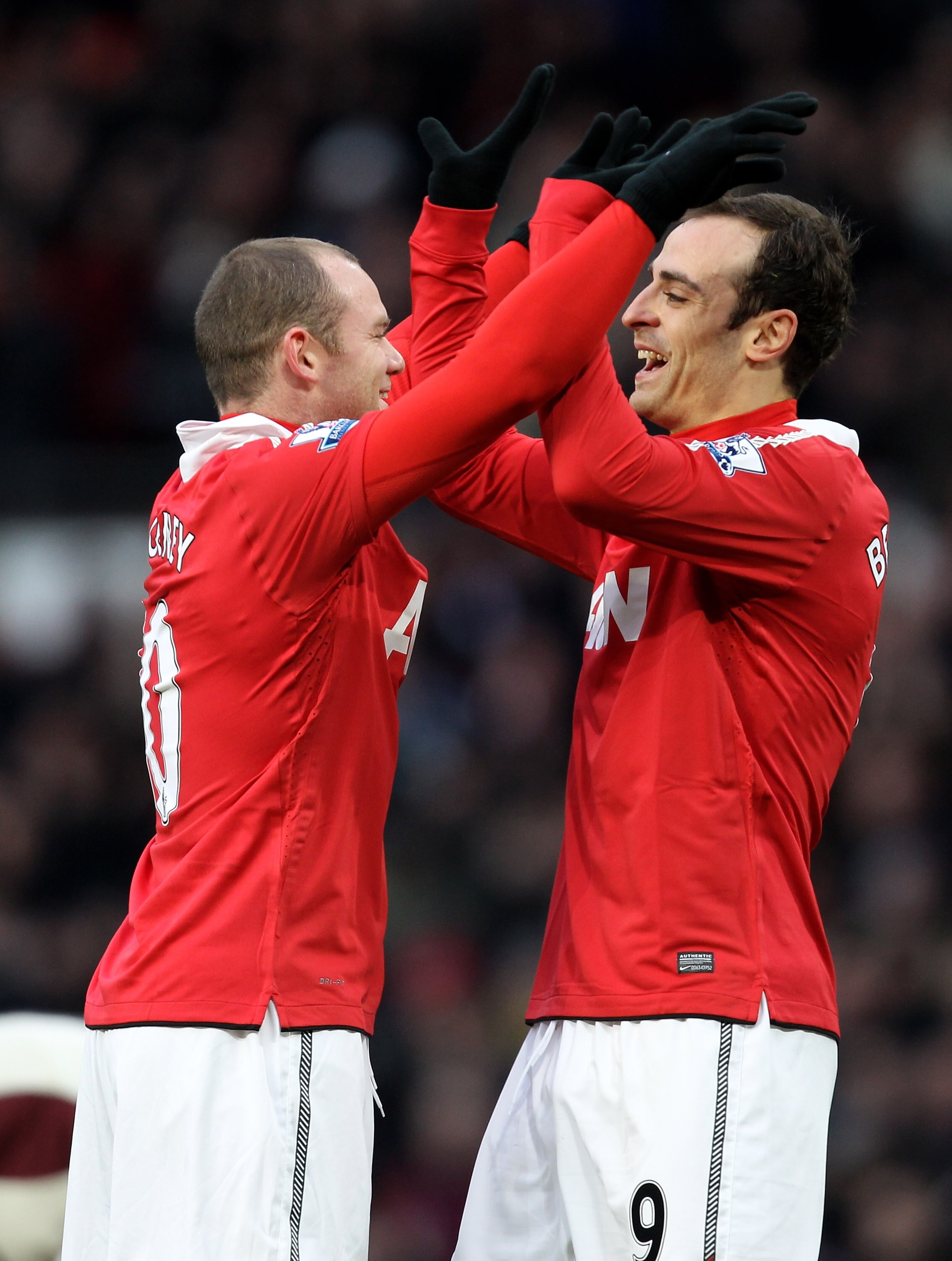 MANCHESTER, ENGLAND - DECEMBER 26:  Dimitar Berbatov of Manchester United celebrates scoring the opening goal with team mate Wayne Rooney (L) during the Barclays Premier League match between Manchester United and Sunderland at Old Trafford on December 26,