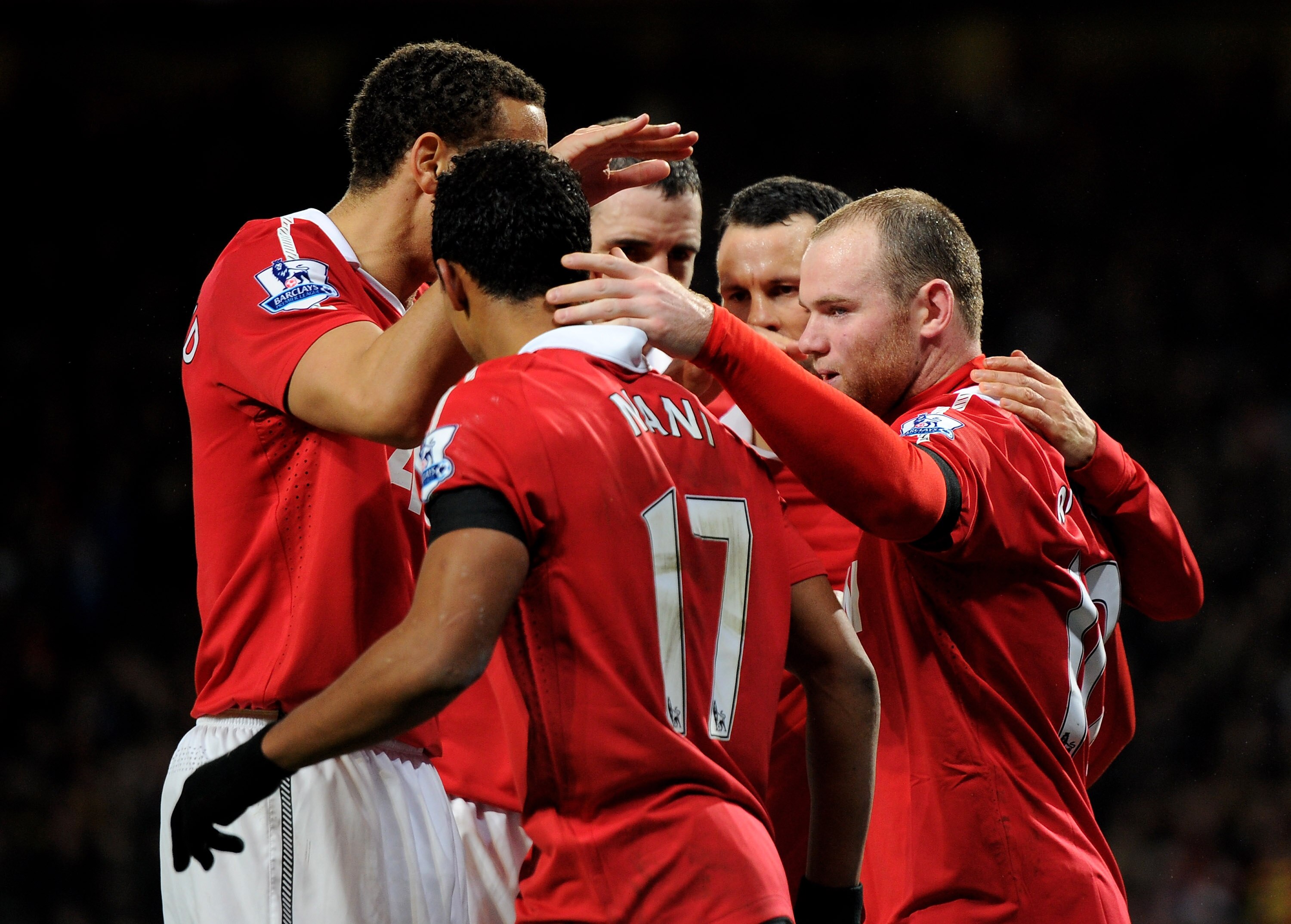 MANCHESTER, ENGLAND - FEBRUARY 01:  Wayne Rooney of Manchester United is congratulated by his team mates after scoring his team's second goal during the Barclays Premier League match between Manchester United and Aston Villa at Old Trafford on February 1,