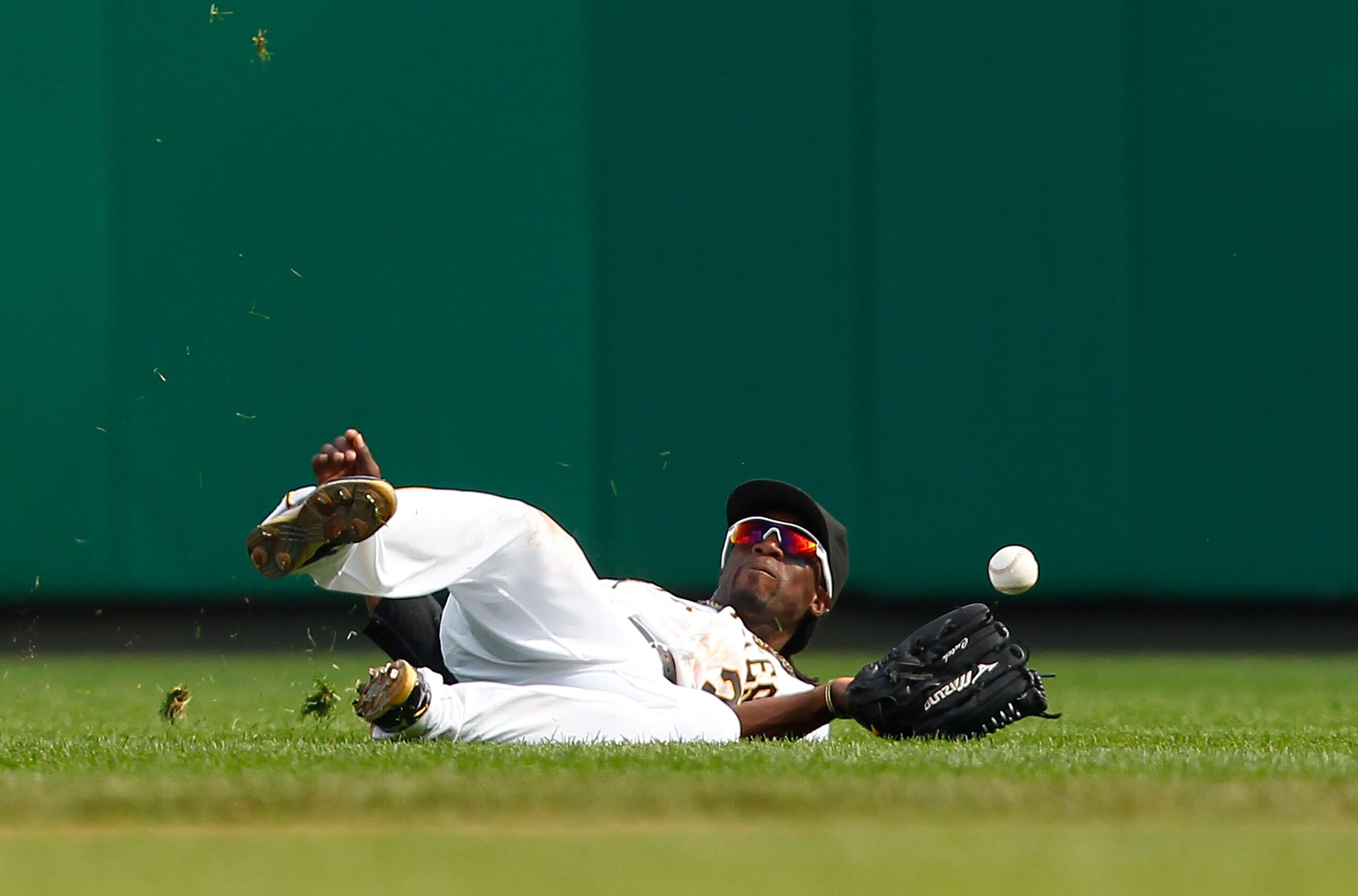 PITTSBURGH - SEPTEMBER 23:  Andrew McCutchen #22 of the Pittsburgh Pirates misses a fly ball in the outfield during the game against the St Louis Cardinals on September 23, 2010 at PNC Park in Pittsburgh, Pennsylvania.  (Photo by Jared Wickerham/Getty Ima