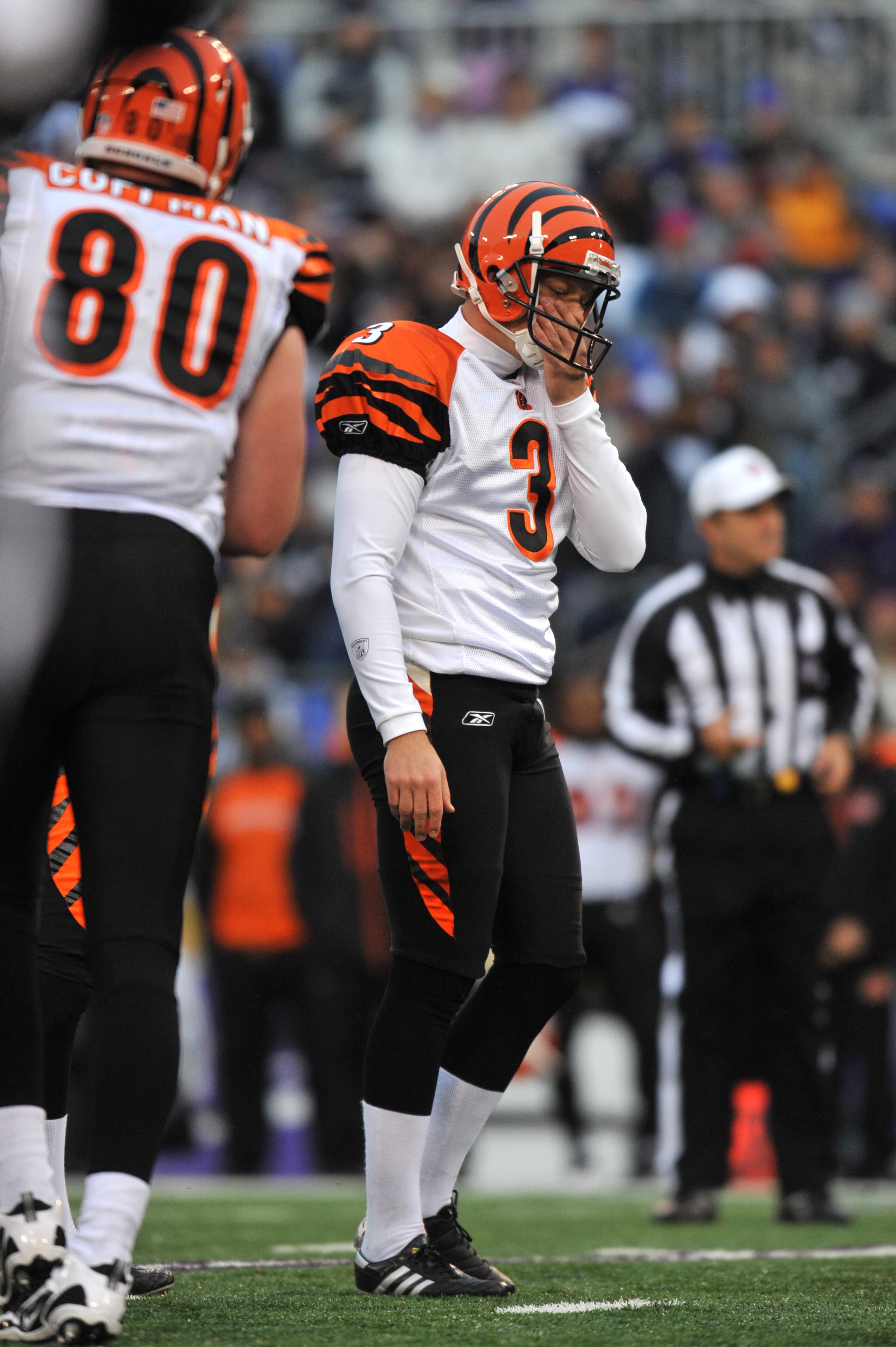 BALTIMORE, MD - JANUARY 2:  Clint Stitser #3 of the Cincinnati Bengals reacts after missing a field goal early in the game against the Baltimore Ravens at M&T Bank Stadium on January 2, 2011 in Baltimore, Maryland. The Ravens defeated the Bengals 13-6. (P