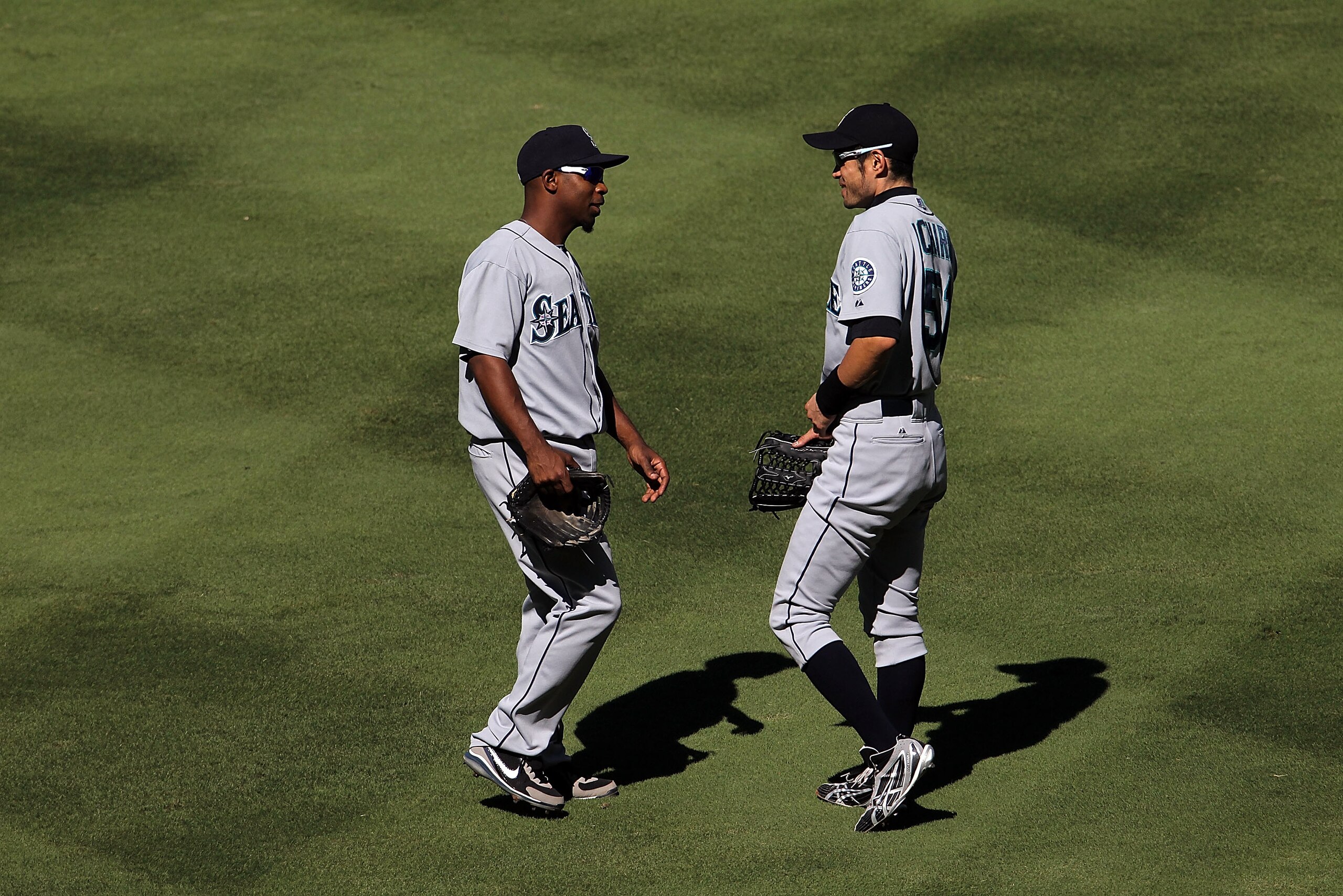 ARLINGTON, TX - SEPTEMBER 29:  Second baseman Chone Figgins #9 and Ichiro Suzuki #51 of the Seattle Mariners at Rangers Ballpark in Arlington on September 29, 2010 in Arlington, Texas.  (Photo by Ronald Martinez/Getty Images)