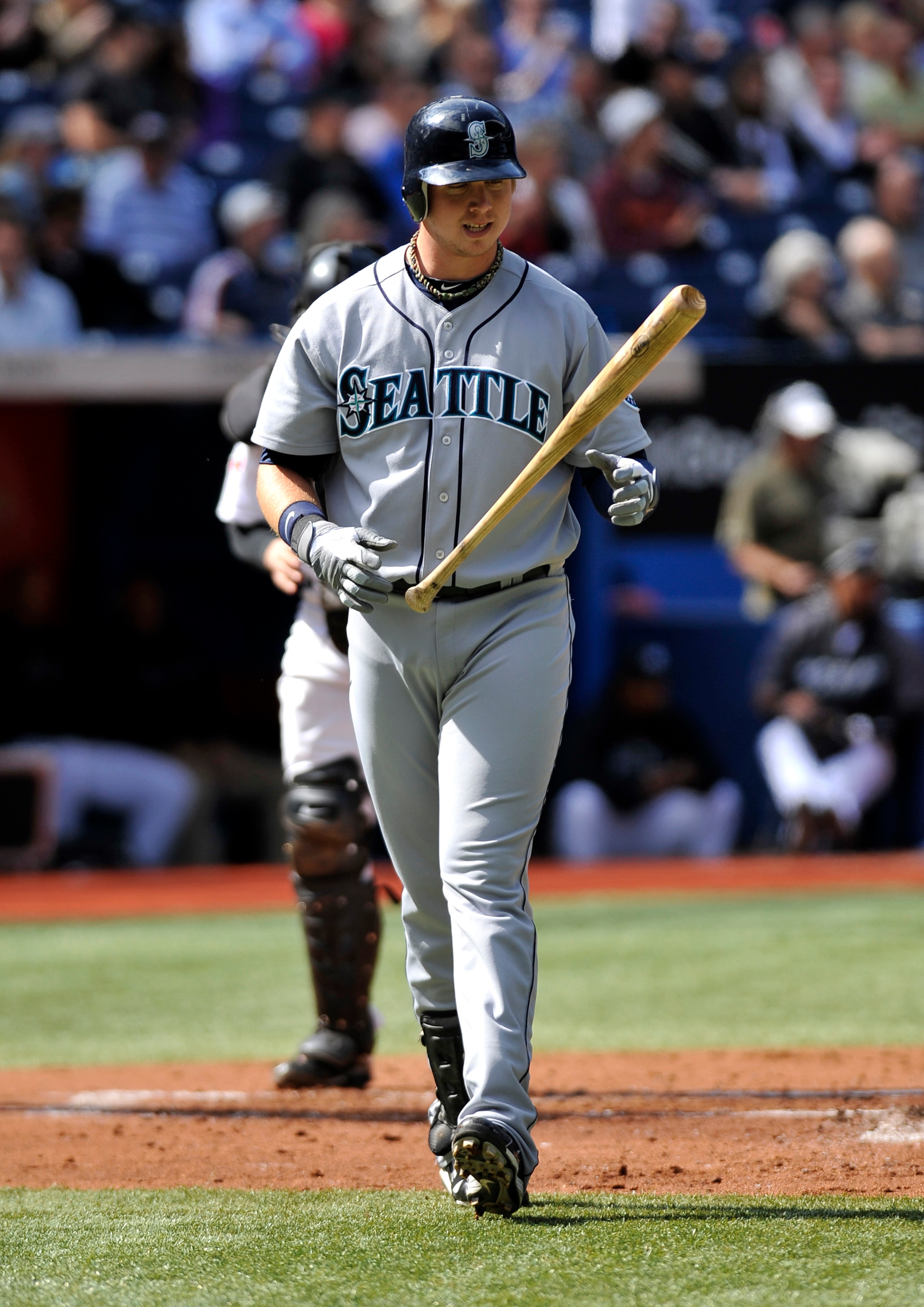 TORONTO - SEPTEMBER 23: Justin Smoak #17 of the Seattle Mariners walks back to the dugout after striking out during the game against the Toronto Blue Jays on September 23, 2010 at Rogers Centre in Toronto, Ontario, Canada. The Blue Jays defeated the Mar TORONTO - SEPTEMBER 23: Justin Smoak #17 of the Seattle Mariners walks back to the dugout after striking out during the game against the Toronto Blue Jays on September 23, 2010 at Rogers Centre in Toronto, Ontario, Canada. The Blue Jays defeated the Mar