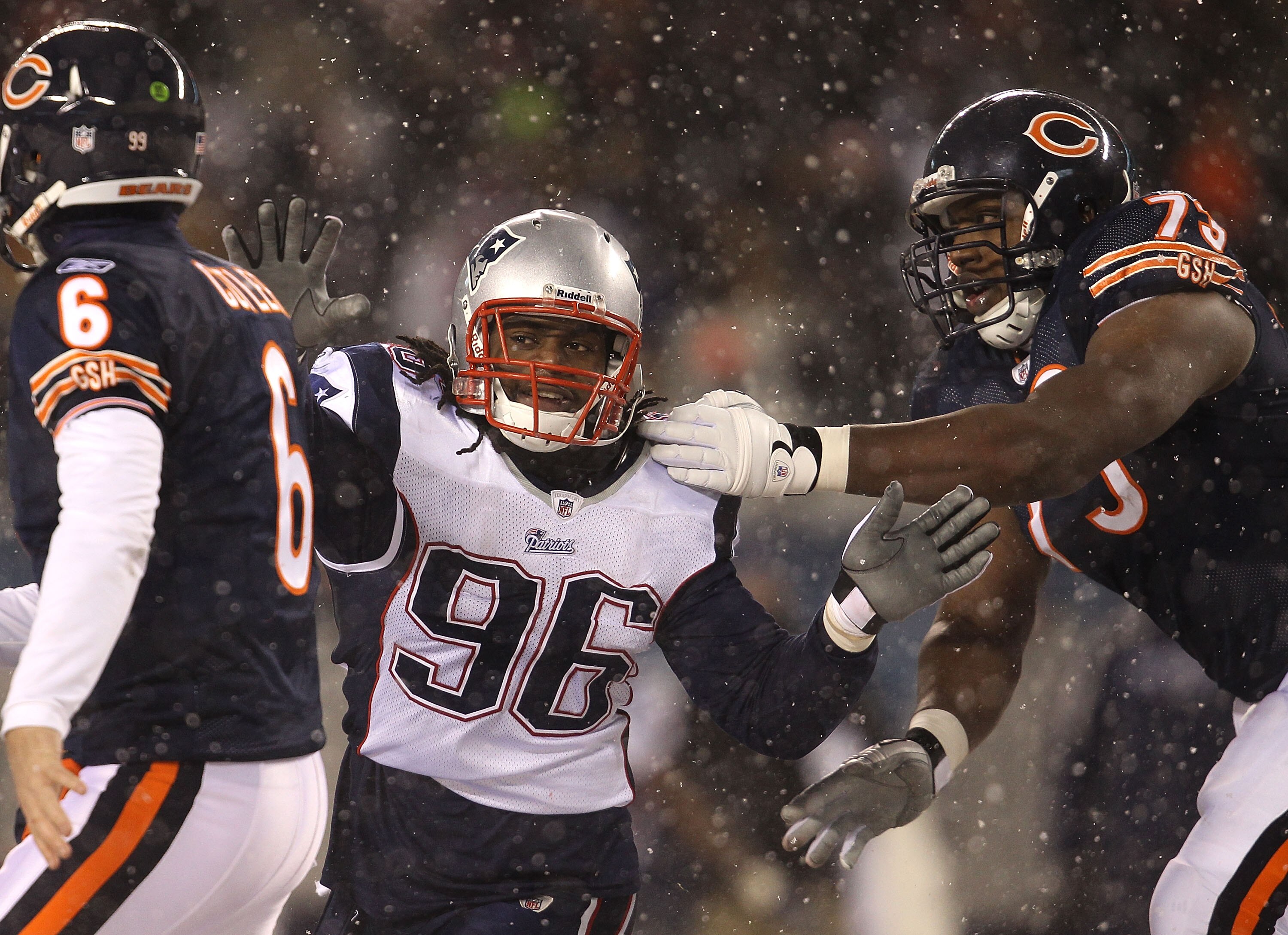 CHICAGO, IL - DECEMBER 12: Jermaine Cunningham #96 of the New England Patriots rushes past J'Marcus Webb #73 of the Chicago Bears towards Jay Cutler #6 at Soldier Field on December 12, 2010 in Chicago, Illinois. The Patriots defeated the Bears 36-7. (Phot