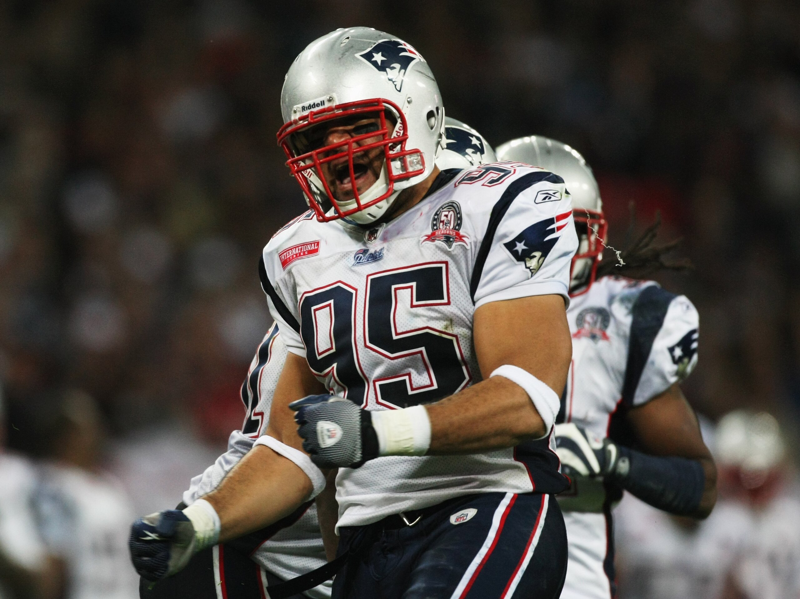LONDON, ENGLAND - OCTOBER 25:  Tully Banta-Cain (#95) of the New England Patriots celebrates scoring the fourth touchdown during the NFL International Series match between New England Patriots and Tampa Bay Buccaneers at Wembley Stadium on October 25, 200