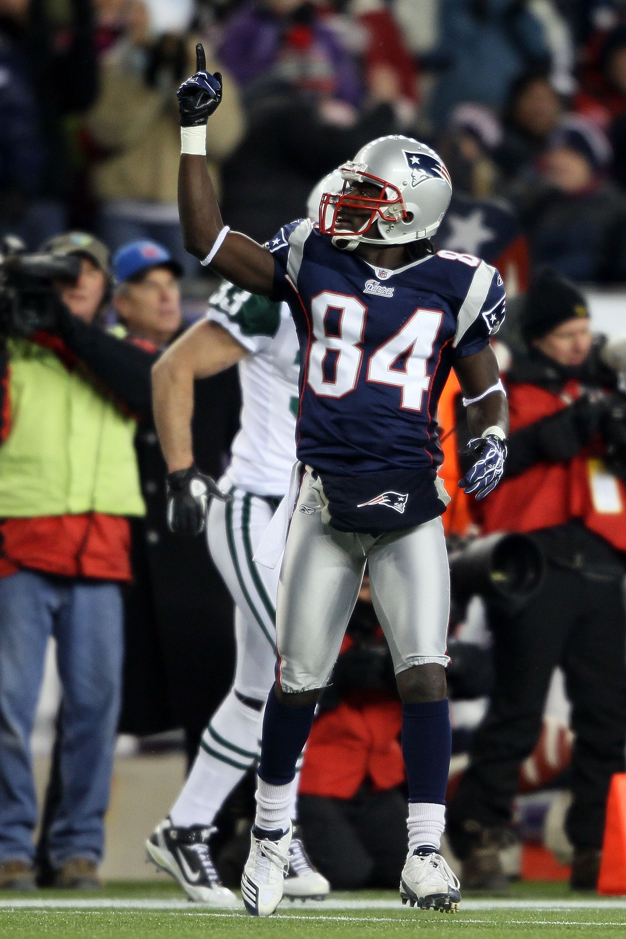 FOXBORO, MA - DECEMBER 06:  Deion Branch #84 of the New England Patriots gestures after he made a reception against the New York Jets at Gillette Stadium on December 6, 2010 in Foxboro, Massachusetts.  (Photo by Elsa/Getty Images)