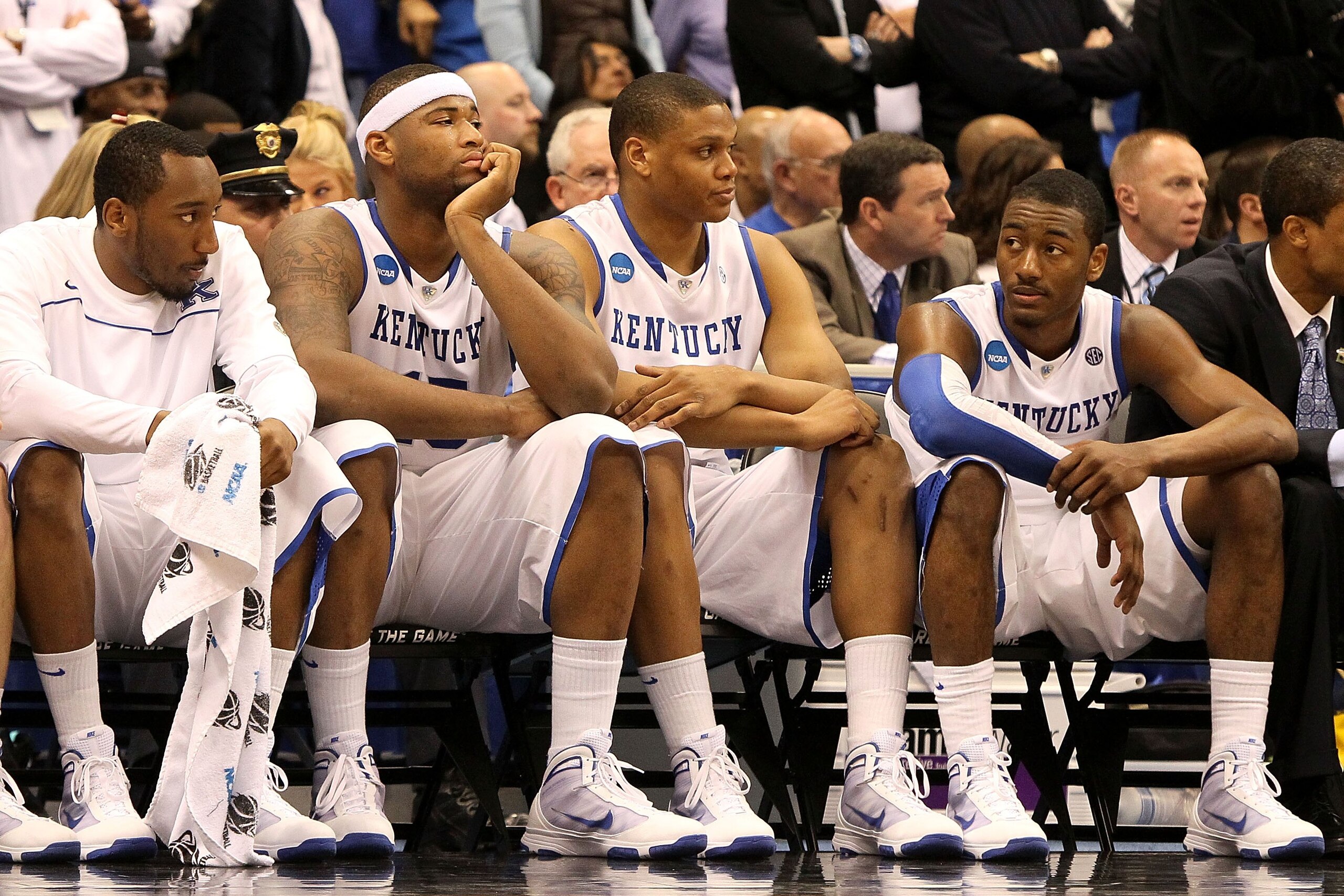 SYRACUSE, NY - MARCH 27: (L-R) Ramon Harris #5, DeMarcus Cousins #15, Daniel Orton #33 and John Wall #11 of the Kentucky Wildcats look on dejected from the bench in the final minute of the second half against the West Virginia Mountaineers during the eas SYRACUSE, NY - MARCH 27: (L-R) Ramon Harris #5, DeMarcus Cousins #15, Daniel Orton #33 and John Wall #11 of the Kentucky Wildcats look on dejected from the bench in the final minute of the second half against the West Virginia Mountaineers during the eas