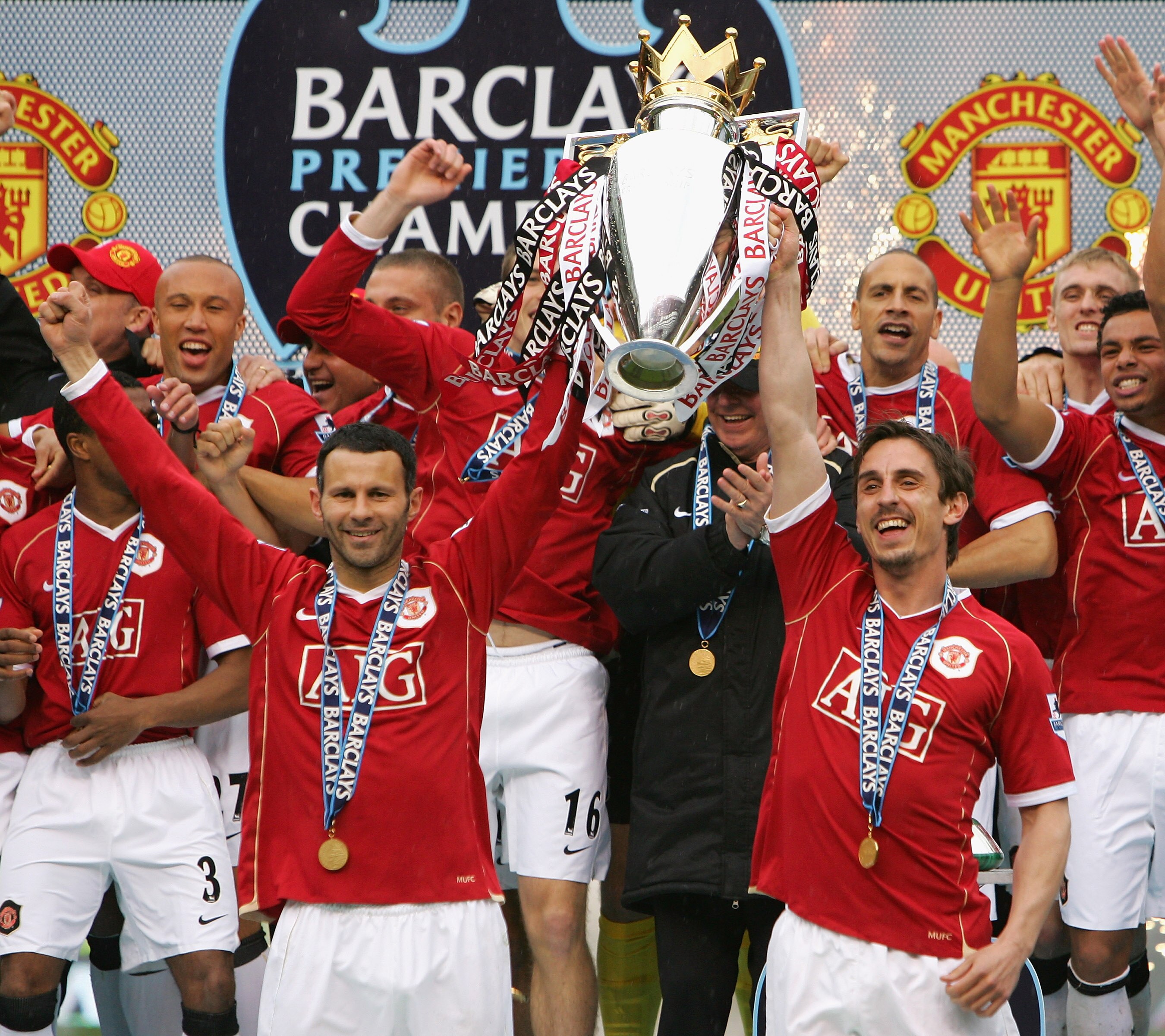 MANCHESTER, UNITED KINGDOM - MAY 13:  Ryan Giggs (L) and Gary Neville of Manchester United lift the Premiership trophy as their team celebrate winning the Premiership title at the end of the Barclays Premiership match between Manchester United and West Ha