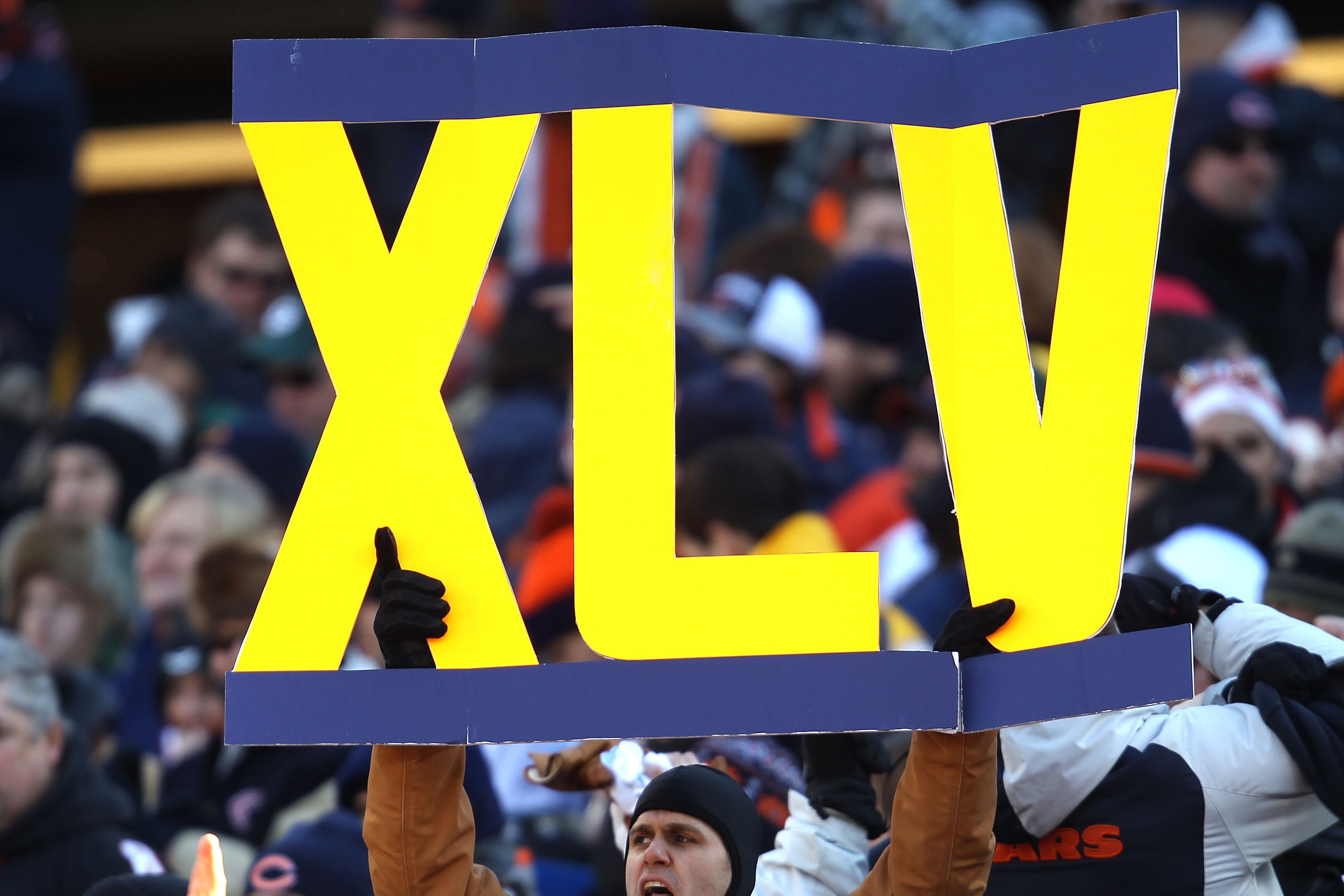 CHICAGO, IL - JANUARY 23:  A fan holds a sign 'XLV'  for the Super Bowl in two weeks in Arlington, Texas in the NFC Championship Game at Soldier Field on January 23, 2011 in Chicago, Illinois.  (Photo by Jonathan Daniel/Getty Images)