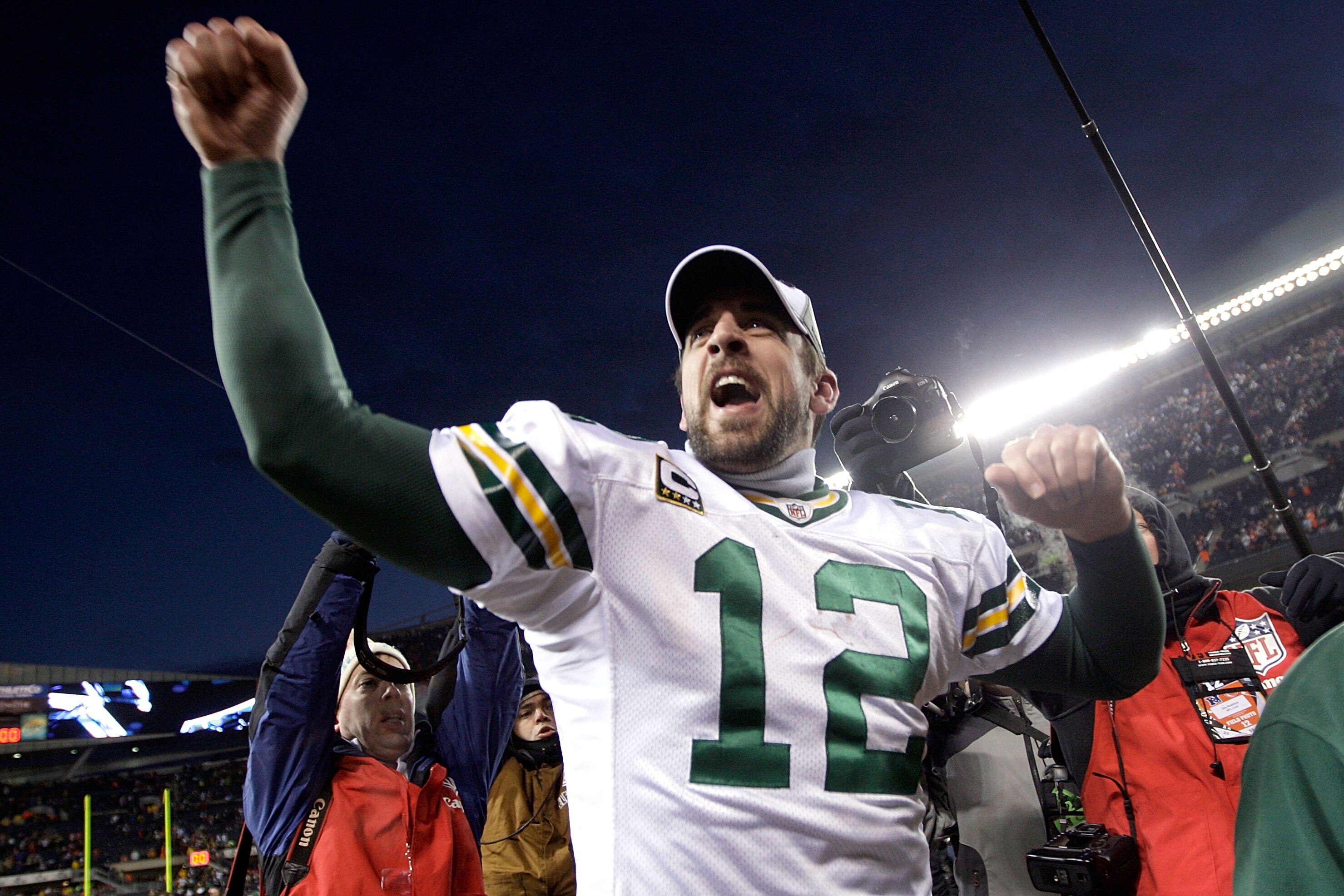 CHICAGO, IL - JANUARY 23:  Quarterback Aaron Rodgers #12 of the Green Bay Packers celebrates the Packers 21-14 victory against the Chicago Bears in the NFC Championship Game at Soldier Field on January 23, 2011 in Chicago, Illinois.  (Photo by Jamie Squir