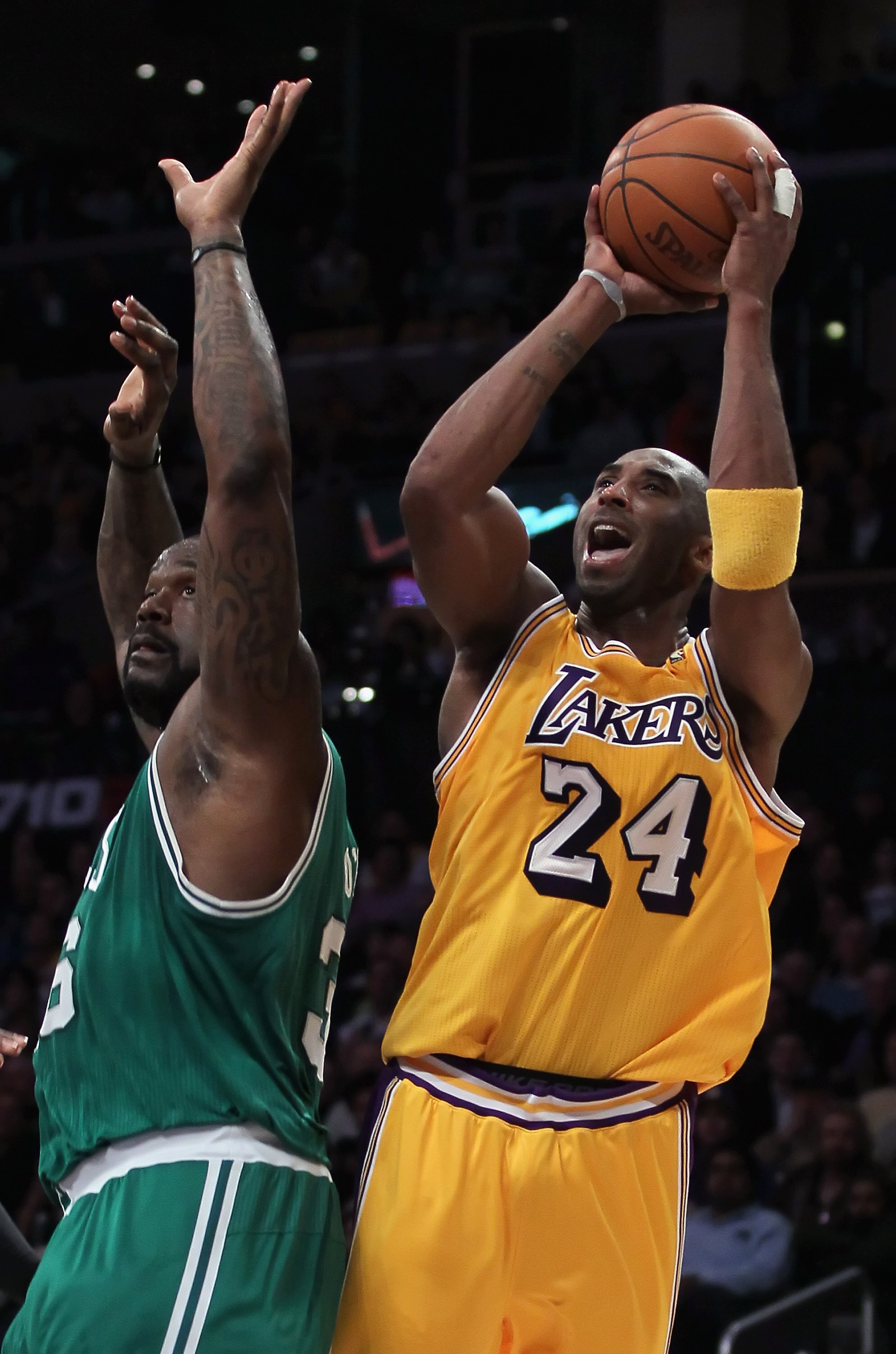 LOS ANGELES, CA - JANUARY 30:  Kobe Bryant #24 of the Los Angeles Lakers is fouled while shooting by Shaquille O'Neal #36 of the Boston Celtics in the first half at Staples Center on January 30, 2011 in Los Angeles, California. The Celtics defeated the La