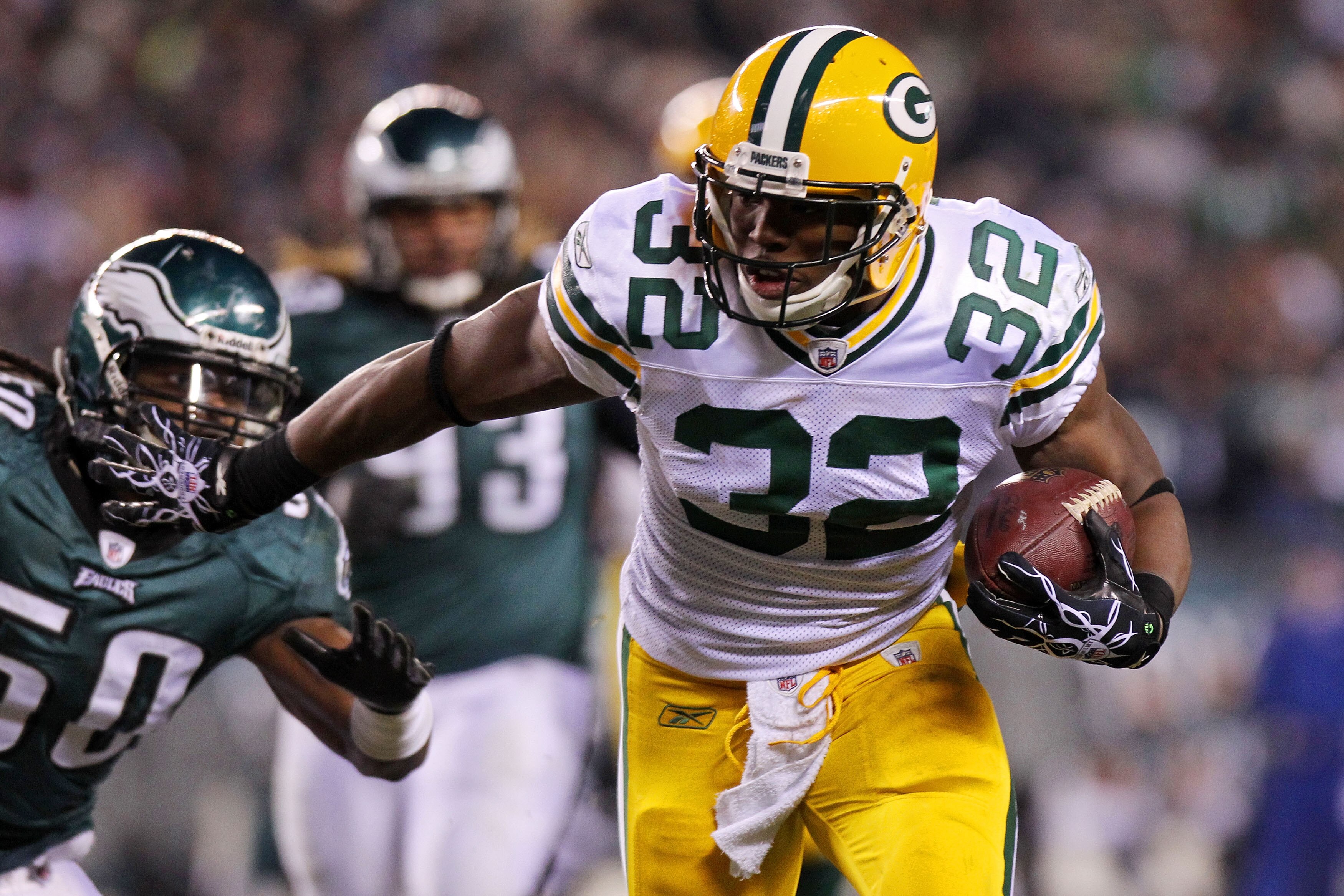 PHILADELPHIA, PA - JANUARY 09:  Brandon Jackson #32 of the Green Bay Packers tries to avoid the takle of Ernie Sims #50 of the Philadelphia Eagles during the 2011 NFC wild card playoff game at Lincoln Financial Field on January 9, 2011 in Philadelphia, Pe