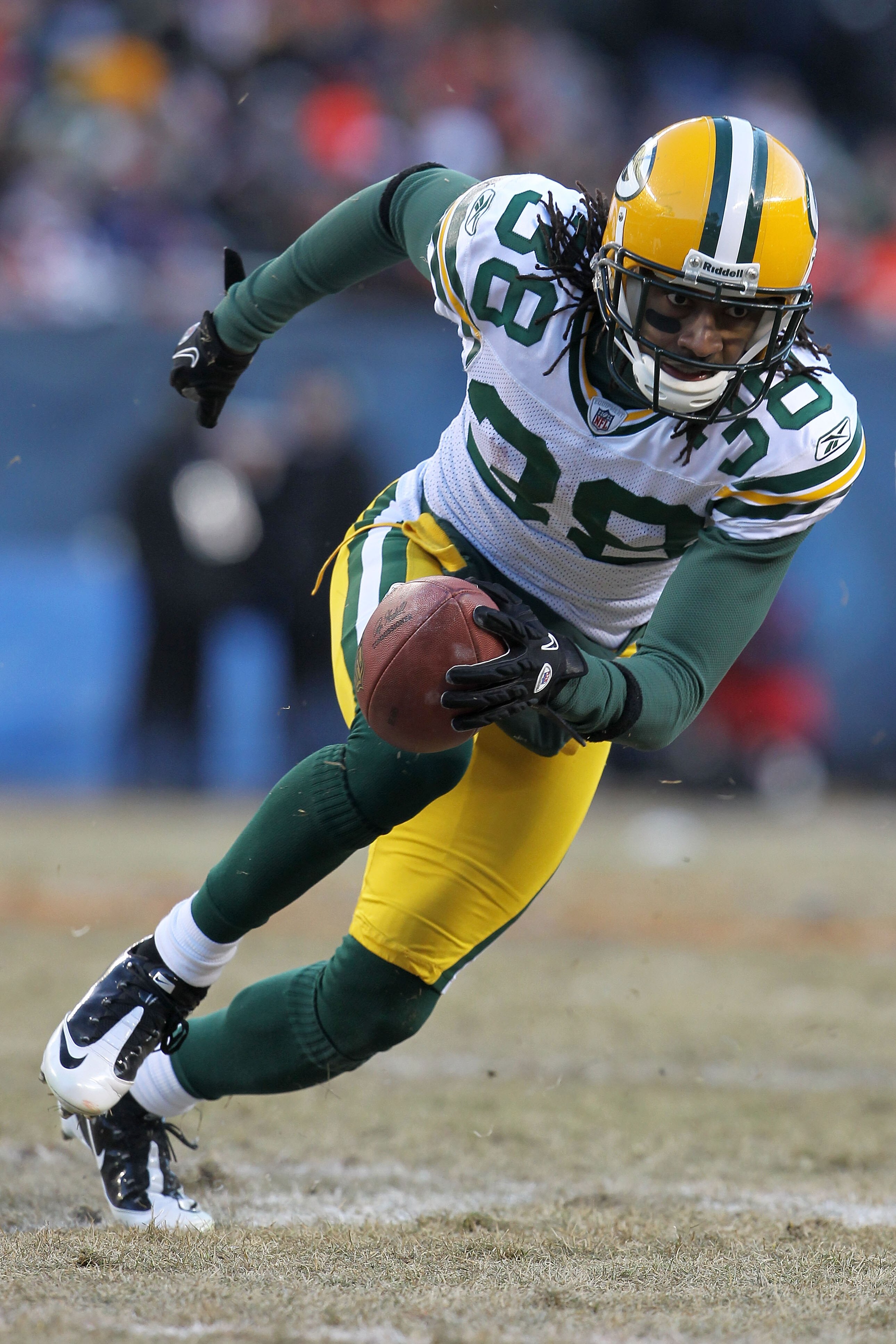 CHICAGO, IL - JANUARY 23:  Tramon Williams #38 of the Green Bay Packers returns a kick against the Chicago Bears in the NFC Championship Game at Soldier Field on January 23, 2011 in Chicago, Illinois.  (Photo by Jamie Squire/Getty Images)