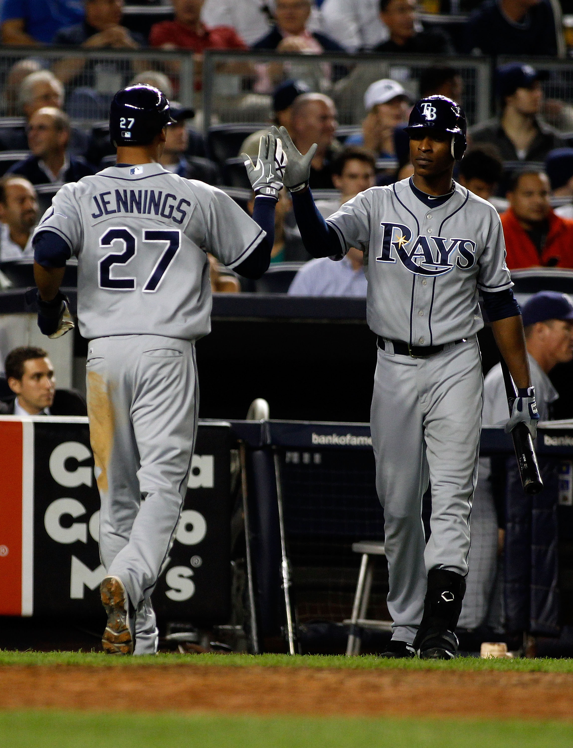 NEW YORK - SEPTEMBER 23:  Desmond Jennings #27 of the Tampa Bay Rays is congratulated by teammate B.J. Upton #2 after scoring on Dan Johnson's sacrifice fly in the seventh -inning against the New York Yankees  on September 23, 2010 at Yankee Stadium in th