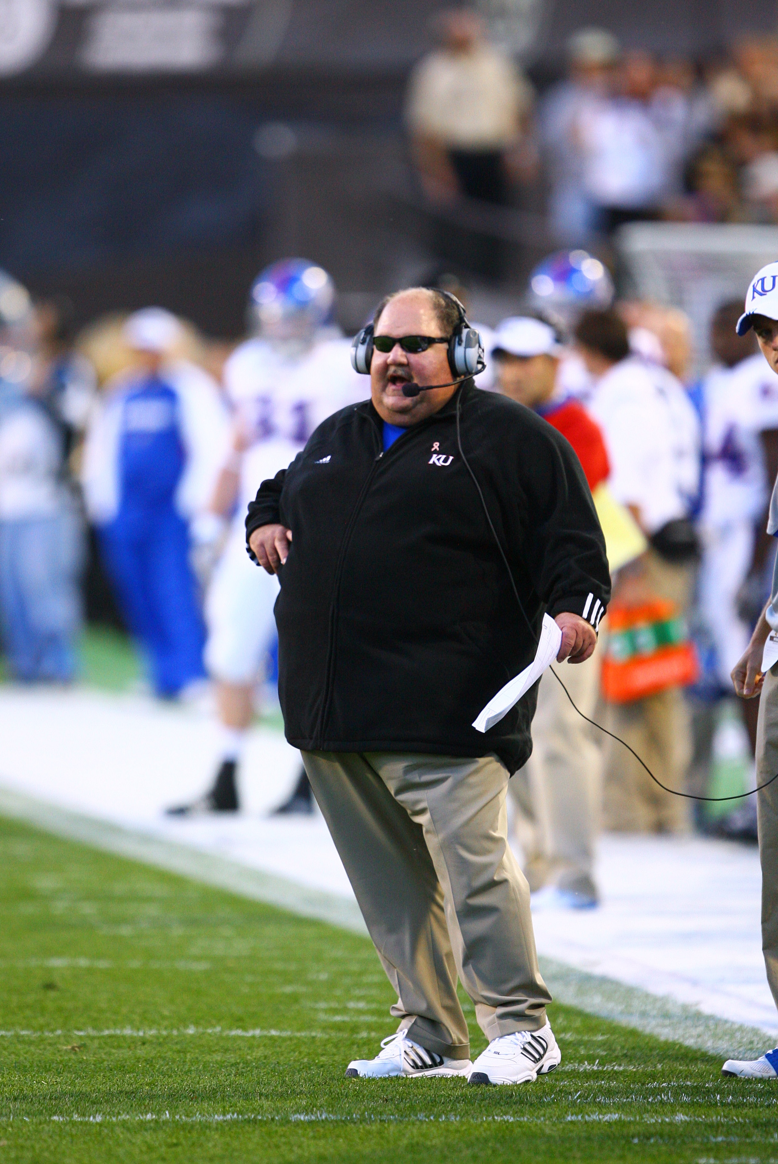 BOULDER, CO - OCTOBER 17: Head coach Mark Mangino of the Kansas Jayhawks calls a play during the game against the University of Colorado at Folsom Field on October 17, 2009 in Boulder, Colorado. (Photo by Garrett W. Ellwood/Getty Images) BOULDER, CO - OCTOBER 17: Head coach Mark Mangino of the Kansas Jayhawks calls a play during the game against the University of Colorado at Folsom Field on October 17, 2009 in Boulder, Colorado. (Photo by Garrett W. Ellwood/Getty Images)