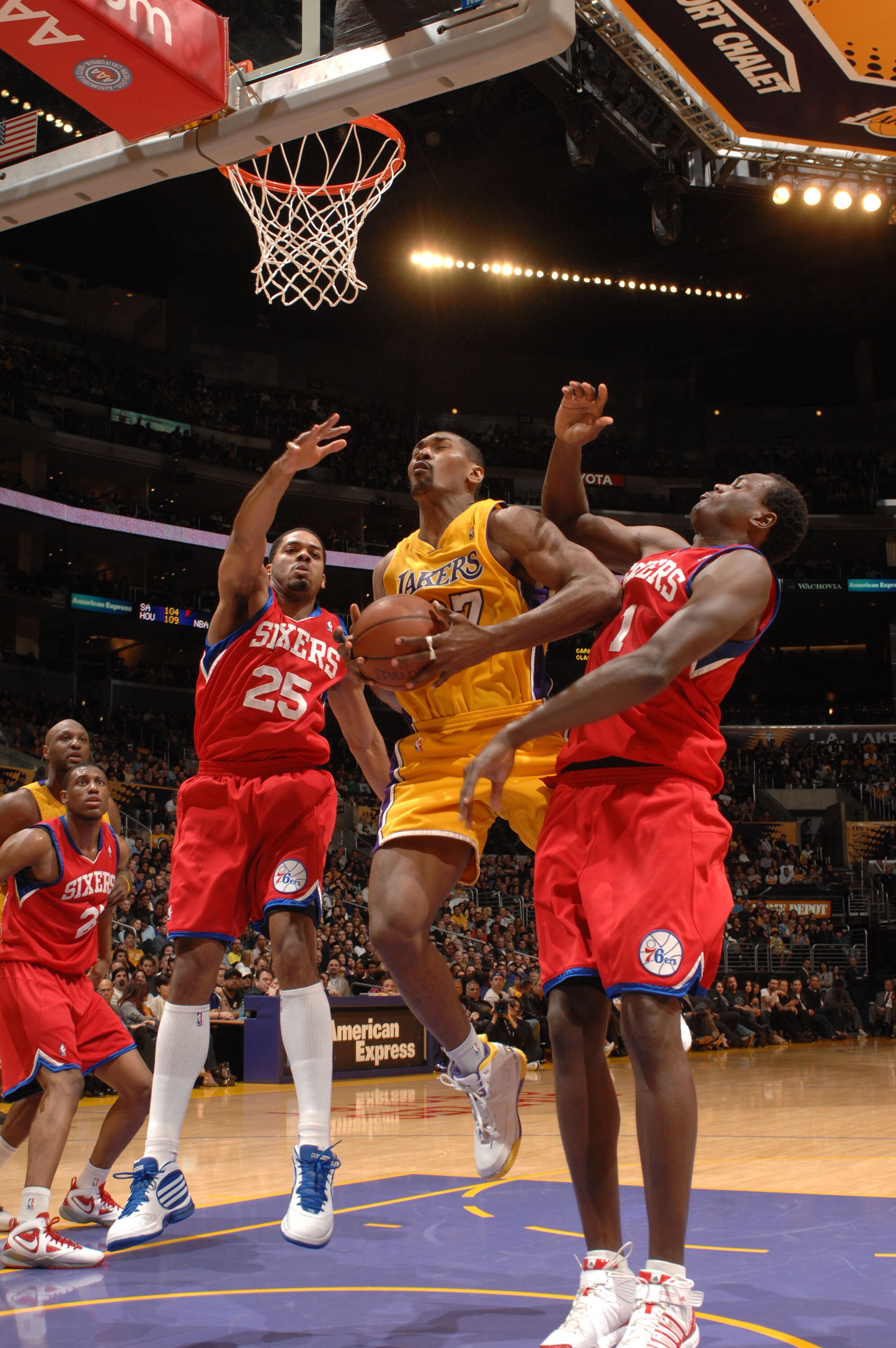 LOS ANGELES - FEBRUARY 26:  Ron Artest #37 of the Los Angeles Lakers attempts a shot between Rodney Carney #25 and Samuel Dalembert #1 of the Philadelphia 76ers at Staples Center on February 26, 2010 in Los Angeles, California. NOTE TO USER: User expressl