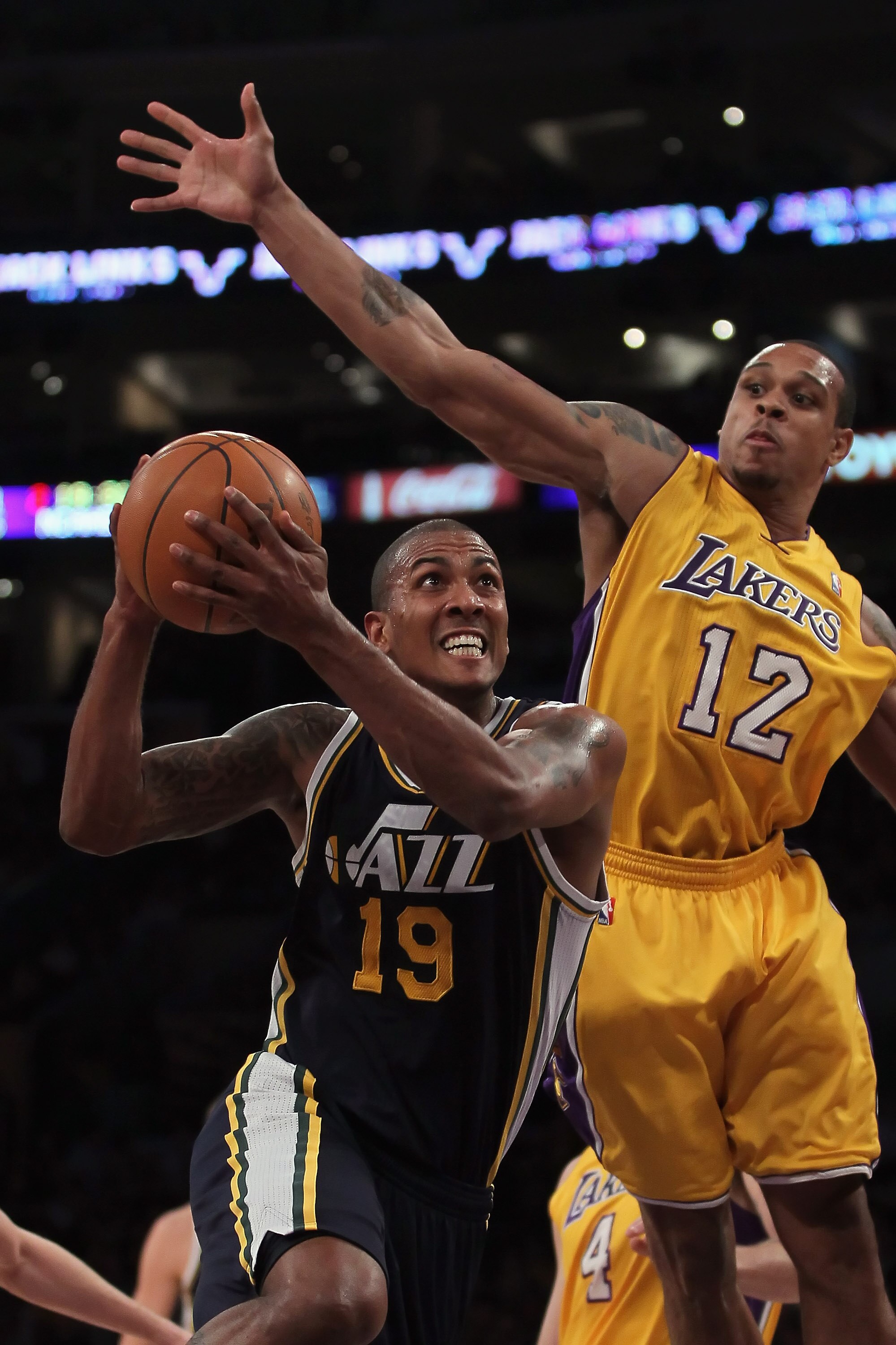 LOS ANGELES, CA - JANUARY 25:  Raja Bell #19 of the Utah Jazz drives to the basket past Shannon Brown #12 of the Los Angeles Lakers in the first half at Staples Center on January 25, 2011 in Los Angeles, California. NOTE TO USER: User expressly acknowledg