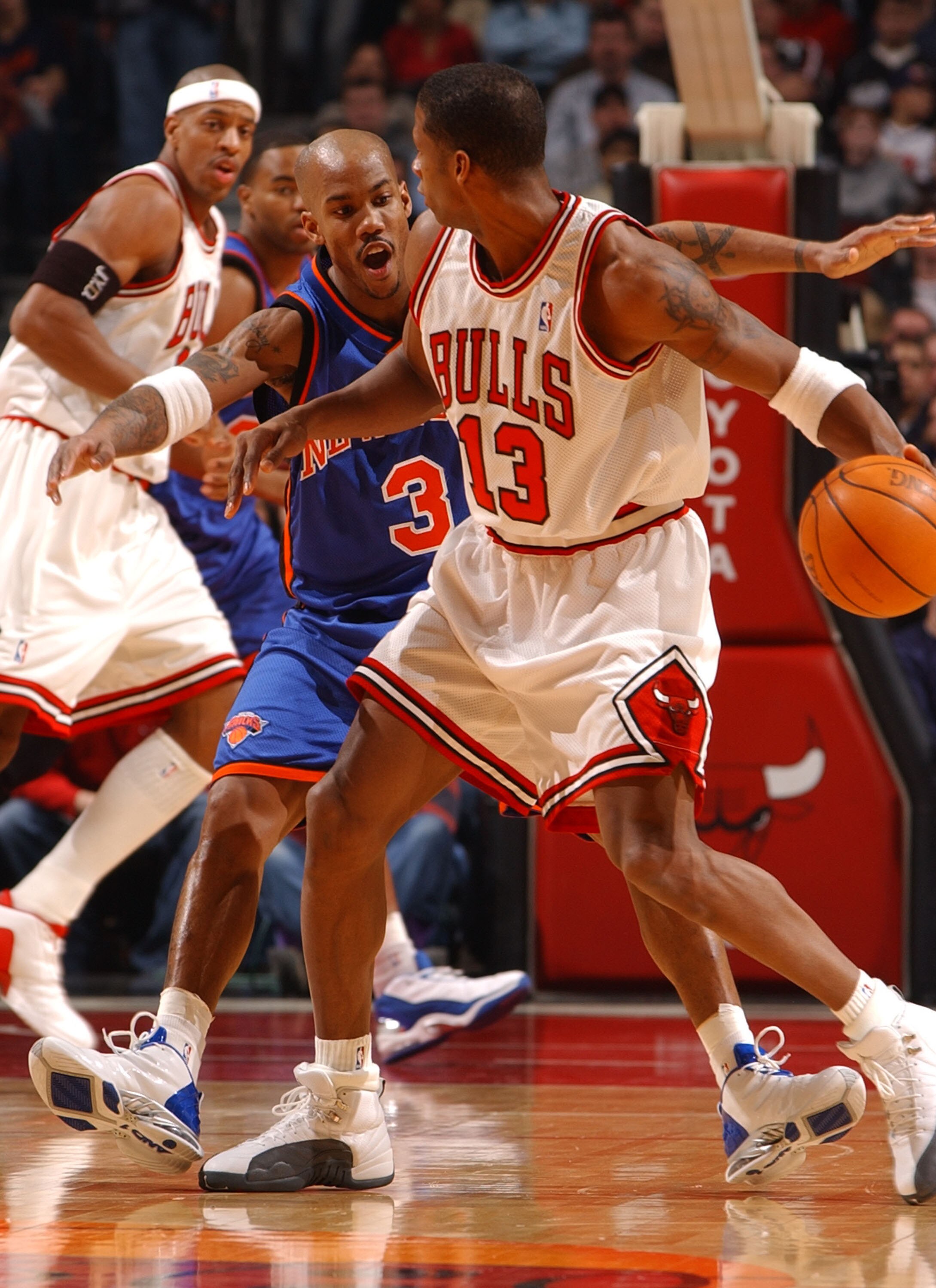 CHICAGO - JANUARY 17: Guard Stephon Marbury #3 of the New York Knicks pressures guard Kendall Gill #13 of the Chicago Bulls during a game on January 17, 2004 at the United Center in Chicago, Illinois. The Knicks defeated the Bulls 101-96. NOTE TO USER: Us