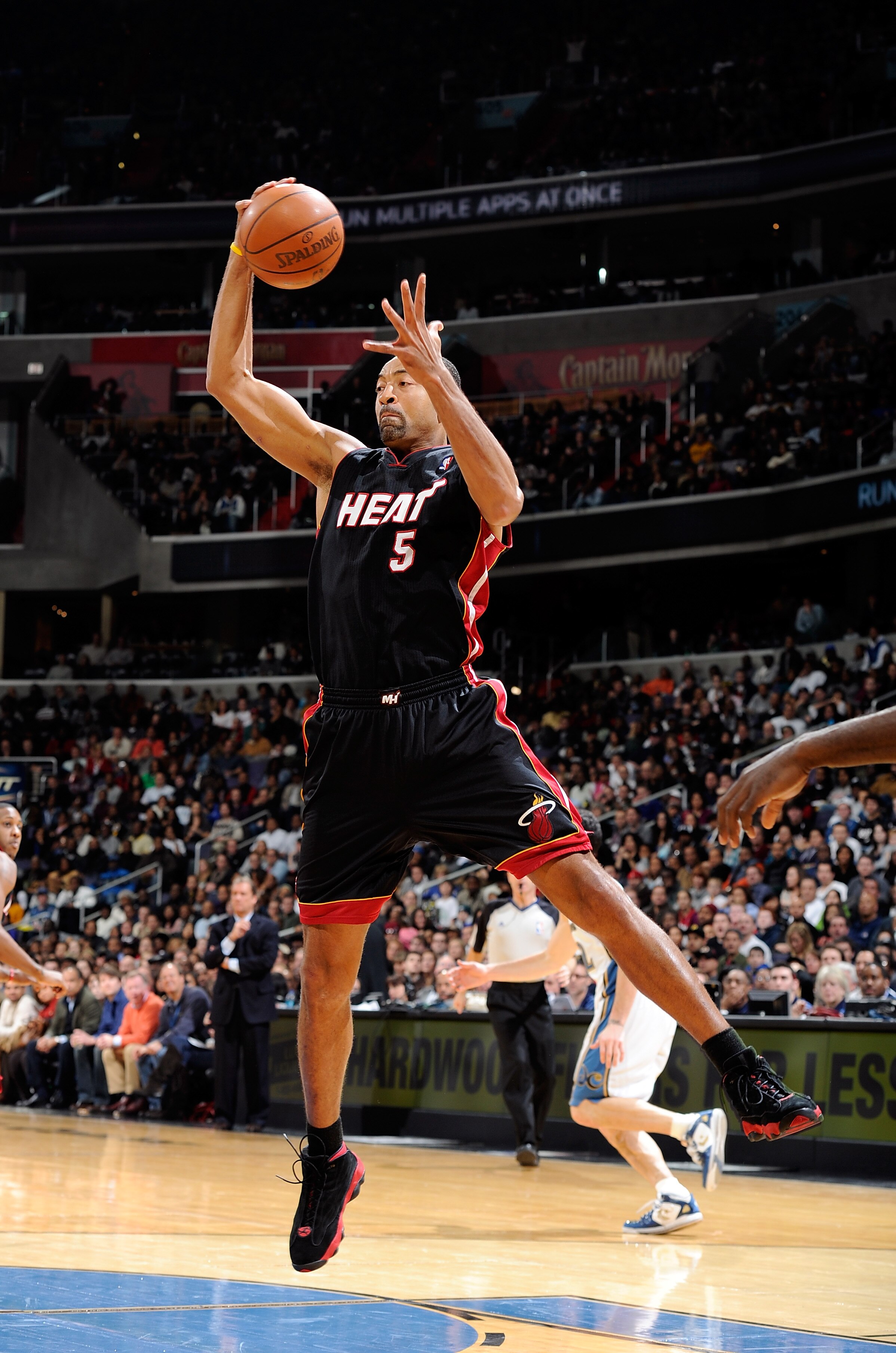 WASHINGTON, DC - DECEMBER 18:  Juwan Howard #5 of the Miami Heat grabs a rebound against the Washington Wizards at the Verizon Center on December 18, 2010 in Washington, DC. NOTE TO USER: User expressly acknowledges and agrees that, by downloading and or
