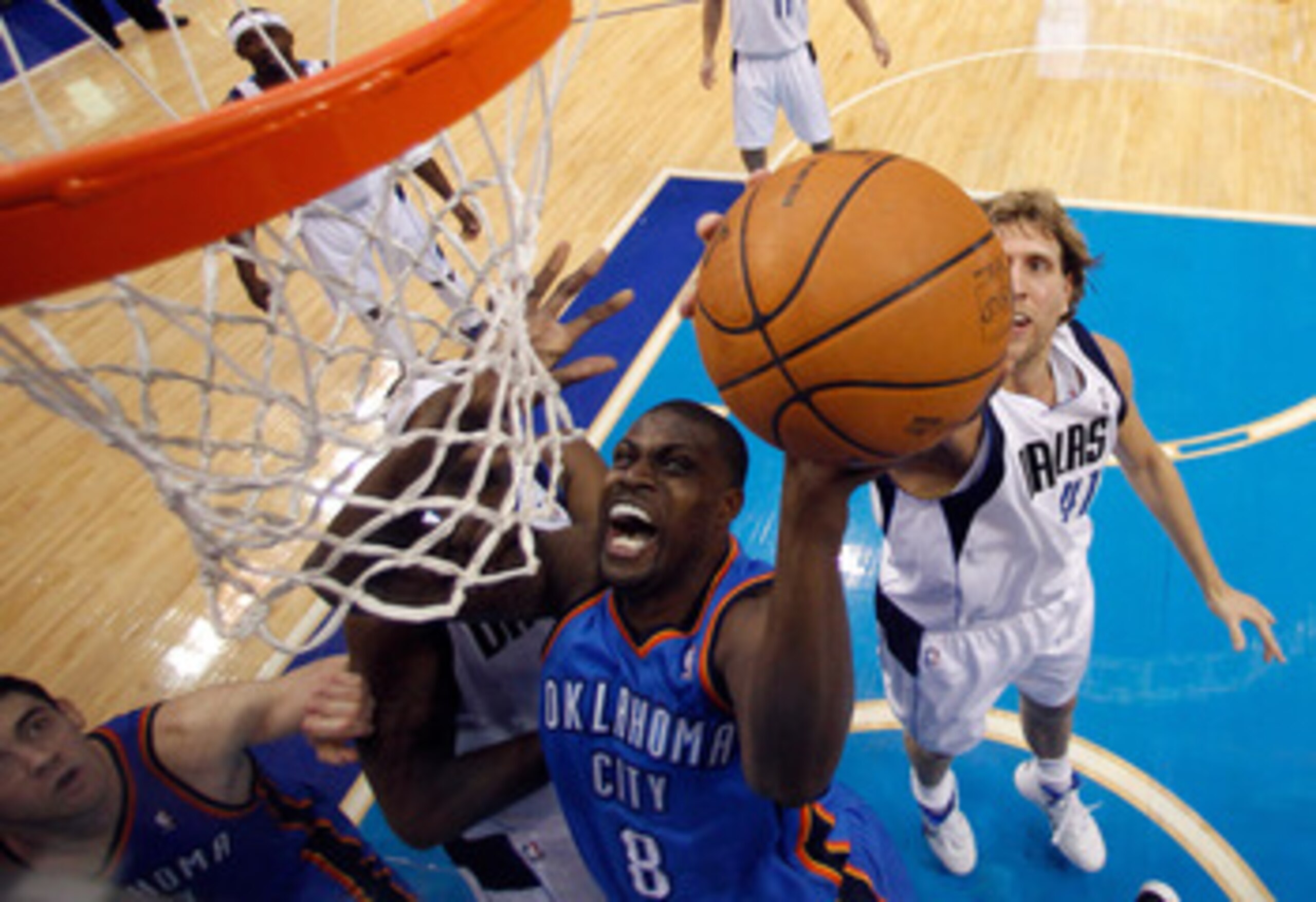 DALLAS, TX - MAY 17:  Nazr Mohammed #8 of the Oklahoma City Thunder goes up for a shot in front of Dirk Nowitzki #41 of the Dallas Mavericks in the first half in Game One of the Western Conference Finals during the 2011 NBA Playoffs at American Airlines C