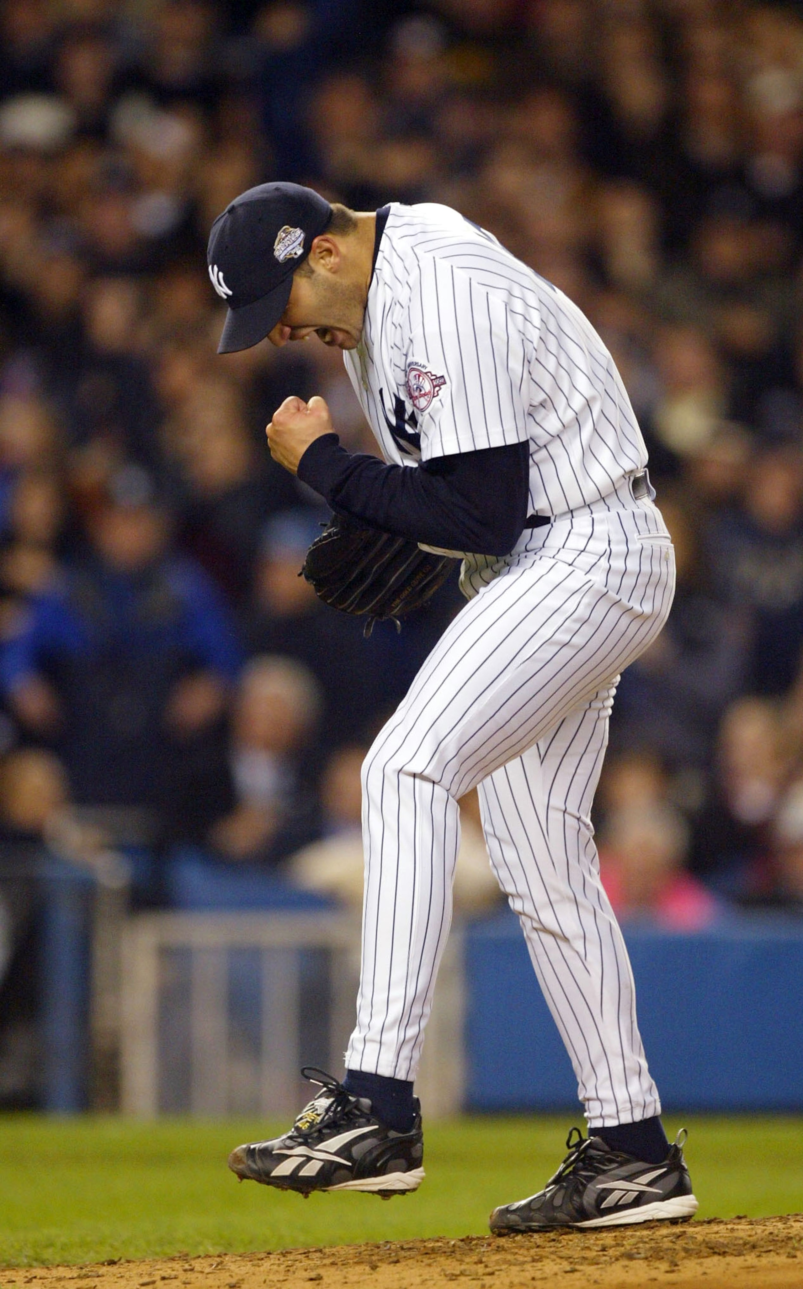 BRONX, NY - OCTOBER 25:  Starting pitcher Andy Pettitte #46 of the New York Yankees reacts after ending the sixth inning against the Florida Marlins during game six of the Major League Baseball World Series on October 25, 2003 at Yankee Stadium in the Bro