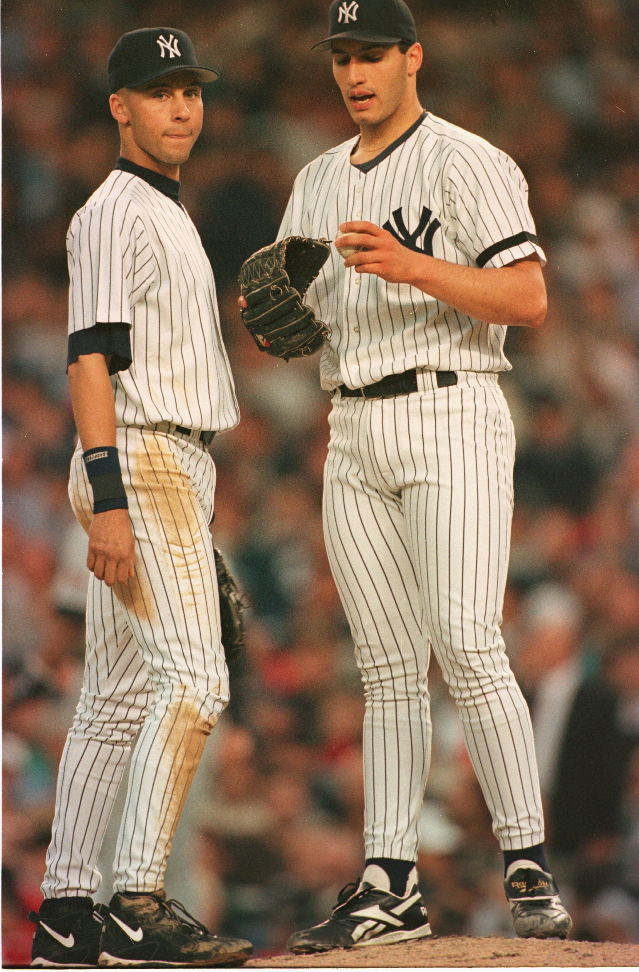 9 Oct 1996:  Pitcher Andy Pettitte of the New York Yankees confers with teammate Derek Jeter on the pitchers mound during their 5-4 win over the Boston Orioles in the first game of the American League Championship at Yankee Stadium in the Bronx, New York,