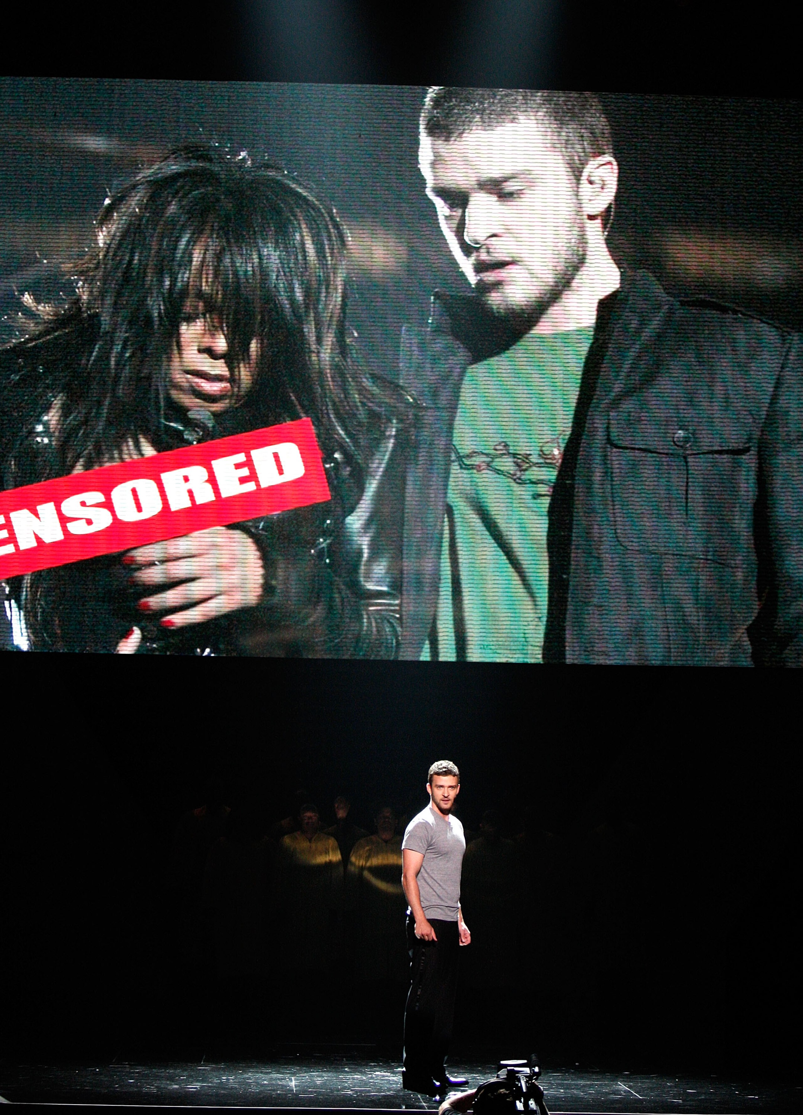 LOS ANGELES, CA - JULY 16:  Host Justin Timberlake stands onstage in front of a video of himself and Janet Jackson from Super Bowl XXXVIII onstage at the 2008 ESPY Awards held at NOKIA Theatre L.A. LIVE on July 16, 2008 in Los Angeles, California.  The 20