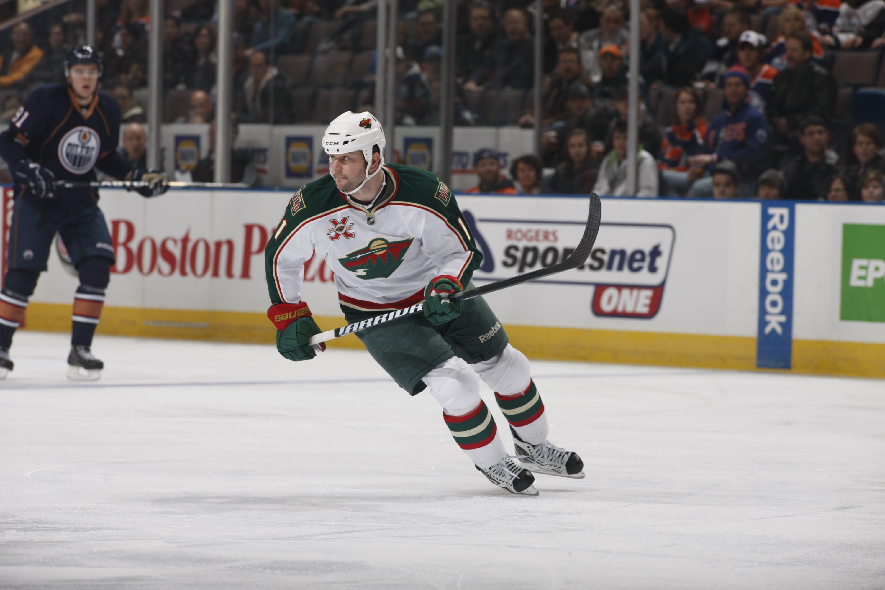 EDMONTON, CANADA - JANUARY 18: John Madden #11 of the Minnesota Wild skates against the Edmonton Oilers on January 18, 2011 at Rexall Place in Edmonton, Alberta, Canada. (Photo by Dale MacMillan/Getty Images)