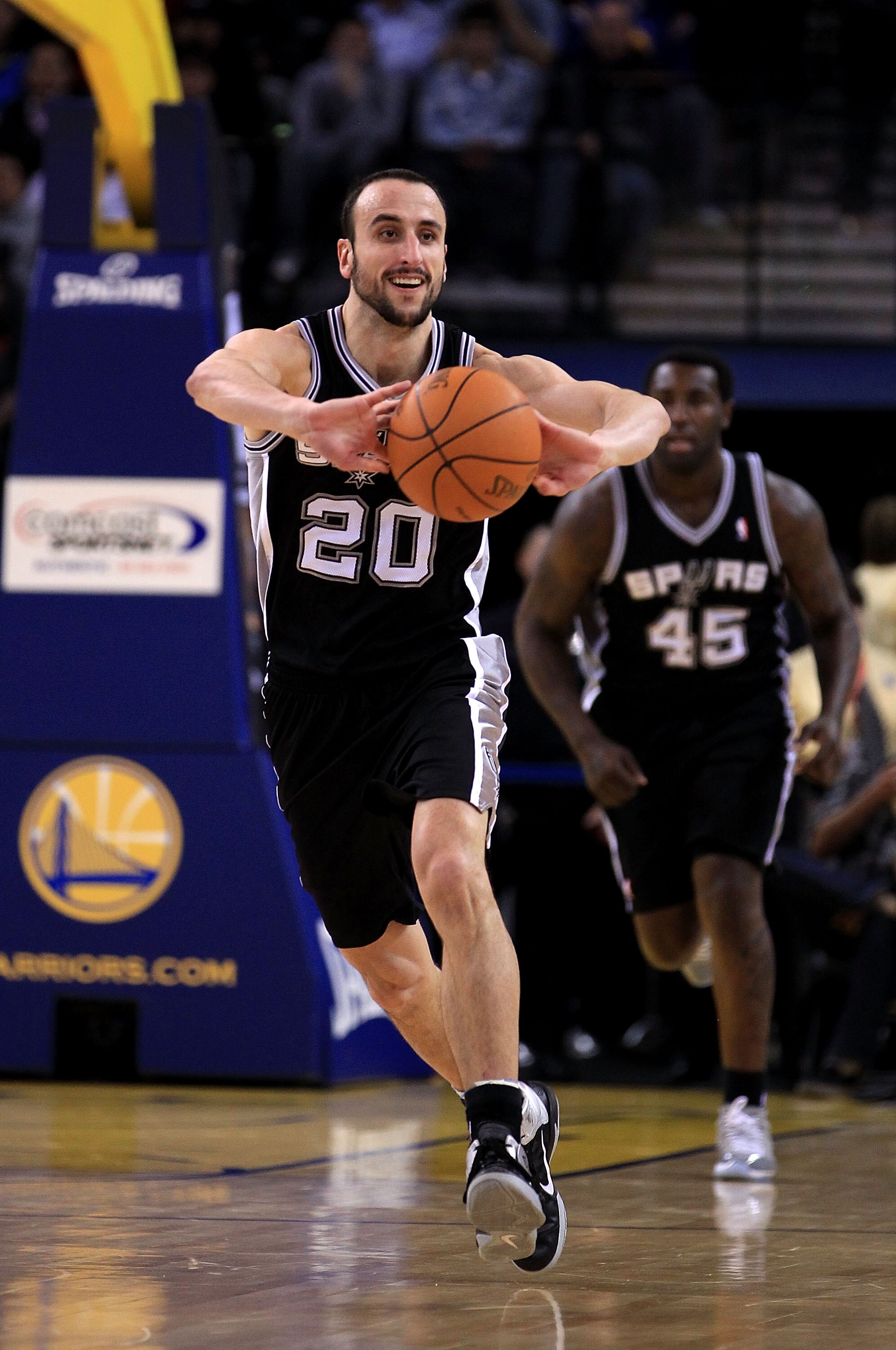 OAKLAND, CA - JANUARY 24:  Manu Ginobili #20 of the San Antonio Spurs in action against the Golden State Warriors at Oracle Arena on January 24, 2011 in Oakland, California.  NOTE TO USER: User expressly acknowledges and agrees that, by downloading and or