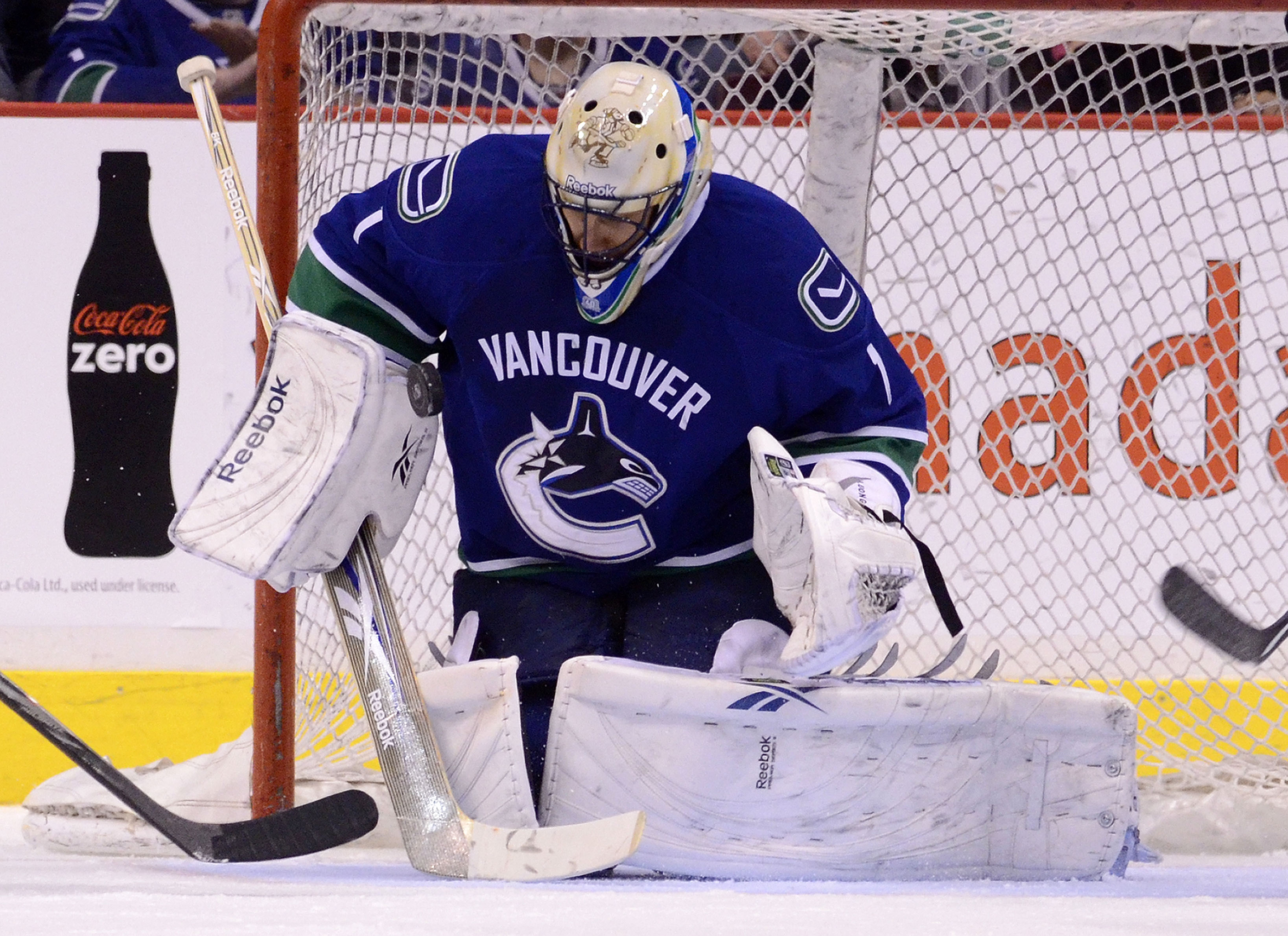 VANCOUVER, CANADA - JANUARY 26: Goalie Roberto Luongo #1 of the Vancouver Canucks makes a save against the Nashville Predators during the second period in NHL action on January 26, 2011 at Rogers Arena in Vancouver, British Columbia, Canada.  (Photo by Ri