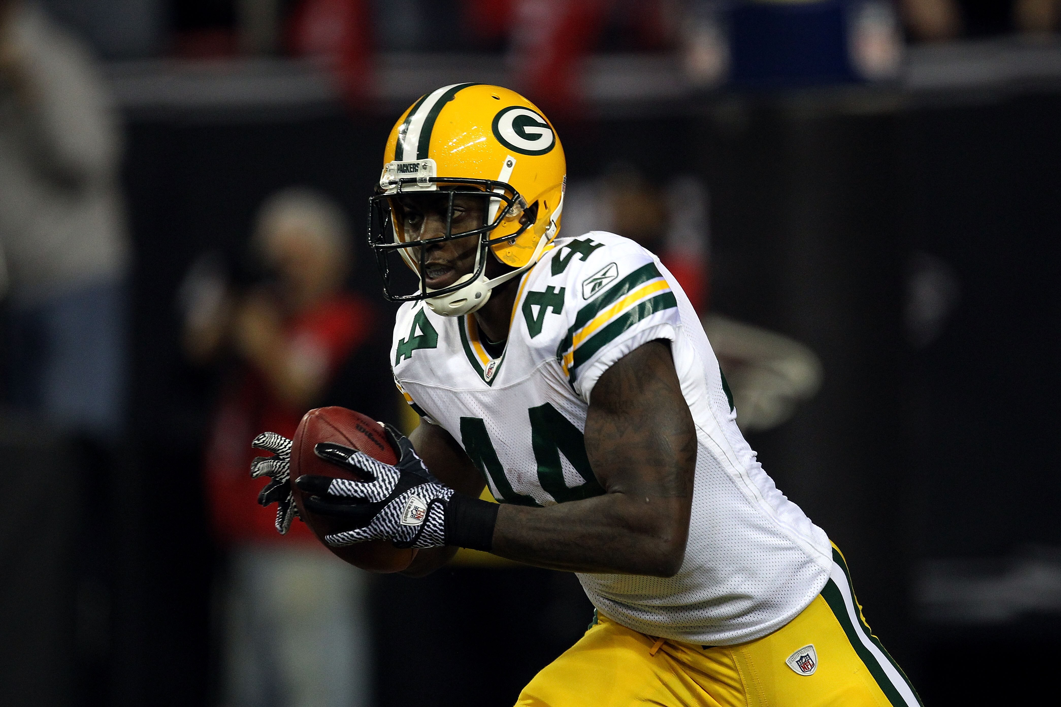 ATLANTA, GA - JANUARY 15:  James Starks #44 of the Green Bay Packers returns a kick against the Atlanta Falcons during their 2011 NFC divisional playoff game at Georgia Dome on January 15, 2011 in Atlanta, Georgia. The Packers won 48-21.  (Photo by Street