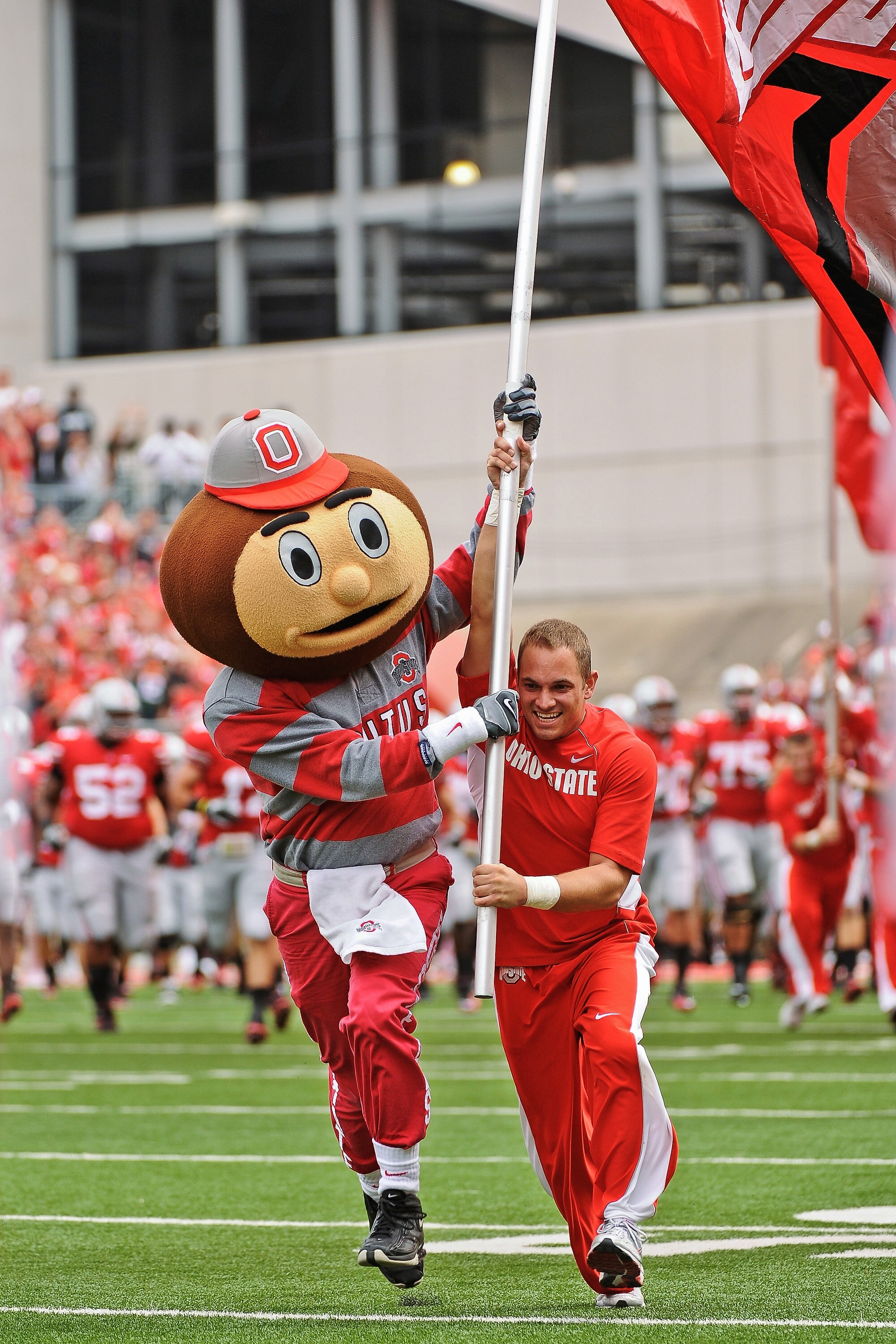 COLUMBUS, OH - SEPTEMBER 11:  Mascot Brutus Buckeye fires up the crowd before a game against the Miami Hurricanes at Ohio Stadium on September 11, 2010 in Columbus, Ohio.  (Photo by Jamie Sabau/Getty Images)
