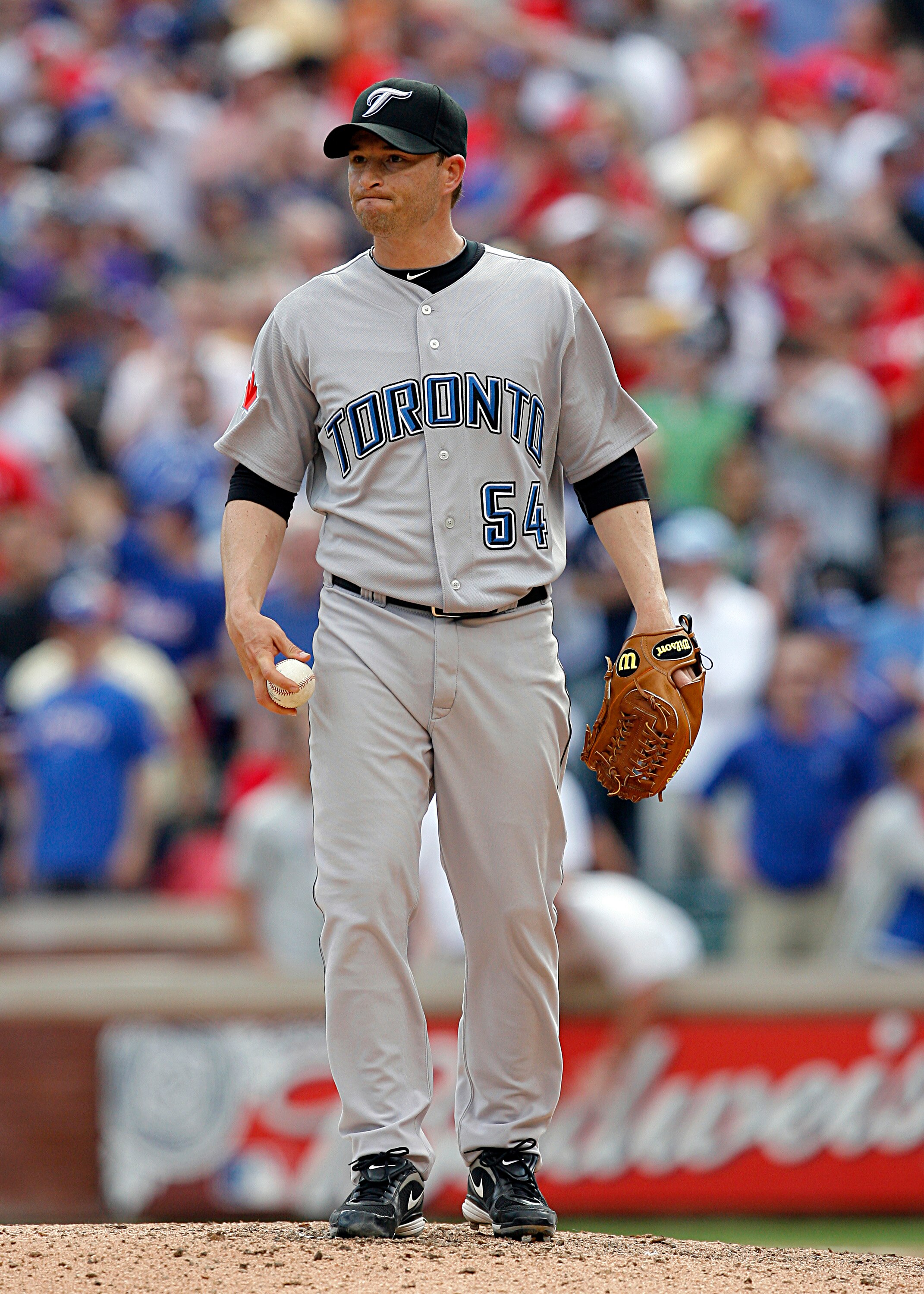 ARLINGTON, TX - APRIL 05: Closing pitcher Jason Frasor #54 of the Toronto Blue Jays reacts after loading the bases against the Texas Rangers in the bottom of the ninth inning on Opening Day at Rangers Ballpark on April 5, 2010 in Arlington, Texas.  The Te