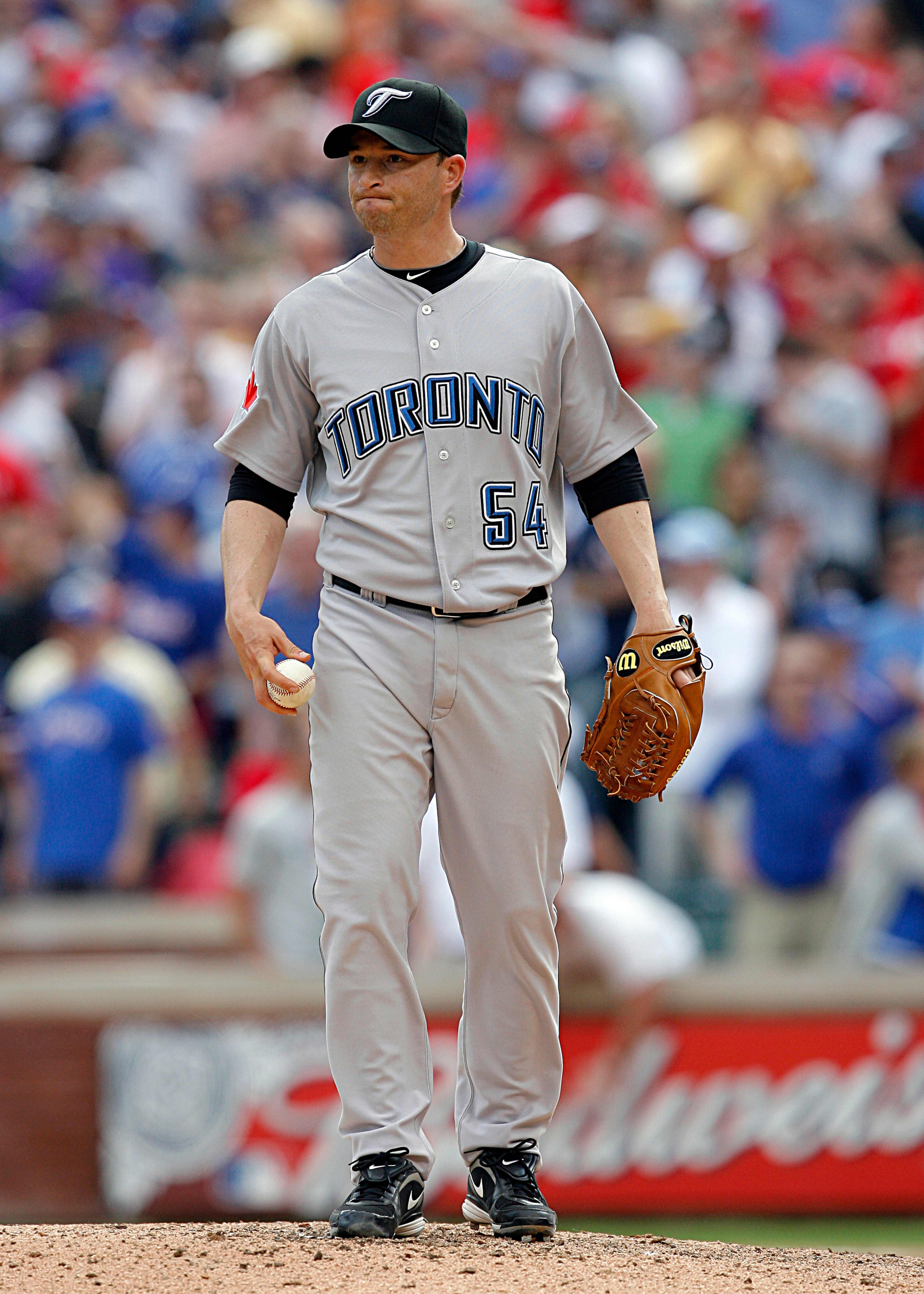 ARLINGTON, TX - APRIL 05: Closing pitcher Jason Frasor #54 of the Toronto Blue Jays reacts after loading the bases against the Texas Rangers in the bottom of the ninth inning on Opening Day at Rangers Ballpark on April 5, 2010 in Arlington, Texas.  The Te