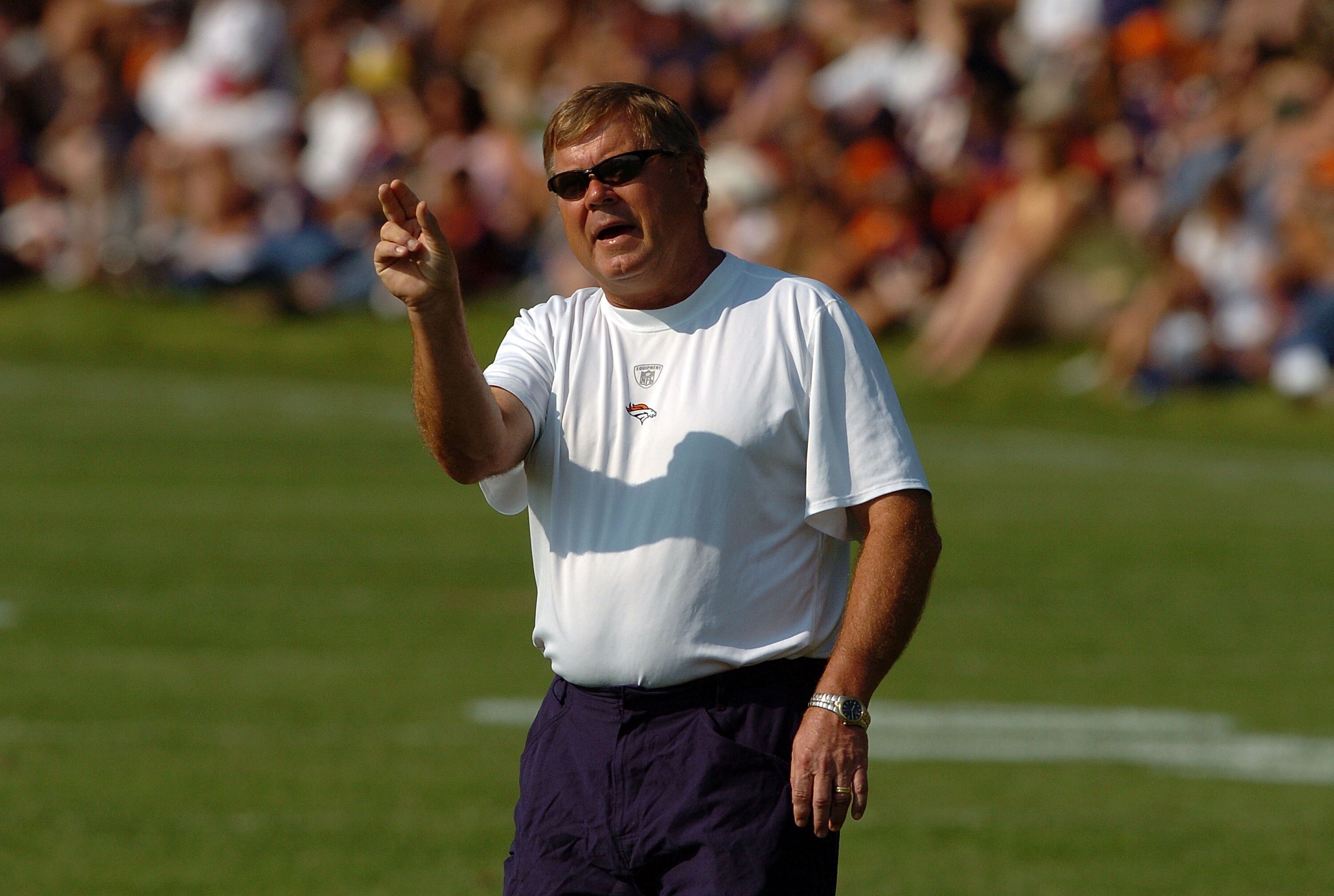 ENGLEWOOD, CO - JULY 31:  Assistant Head Coach/Quarterbacks Mike Heimerdinger  yells out instructions during workouts at training camp on July 31, 2007 at the Paul D. Bowlen Memorial Broncos Centre in Englewood, Colorado.   (Photo by Steve Dykes/Getty Ima