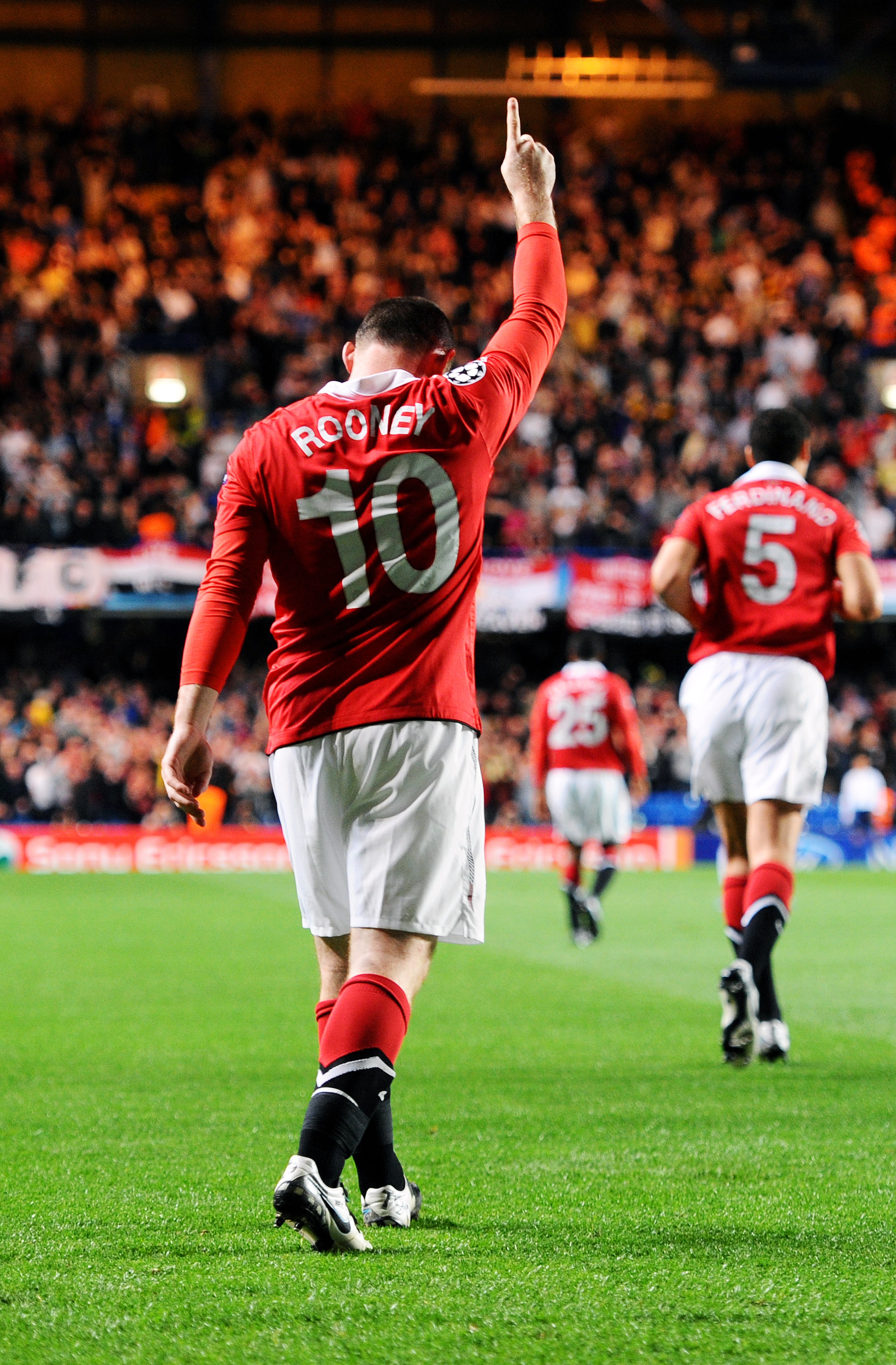 LONDON, ENGLAND - APRIL 06:  Wayne Rooney #10 of Manchester United celebrates after scoring the opening goal during the UEFA Champions League quarter final first leg match between Chelsea and Manchester United at Stamford Bridge on April 6, 2011 in London