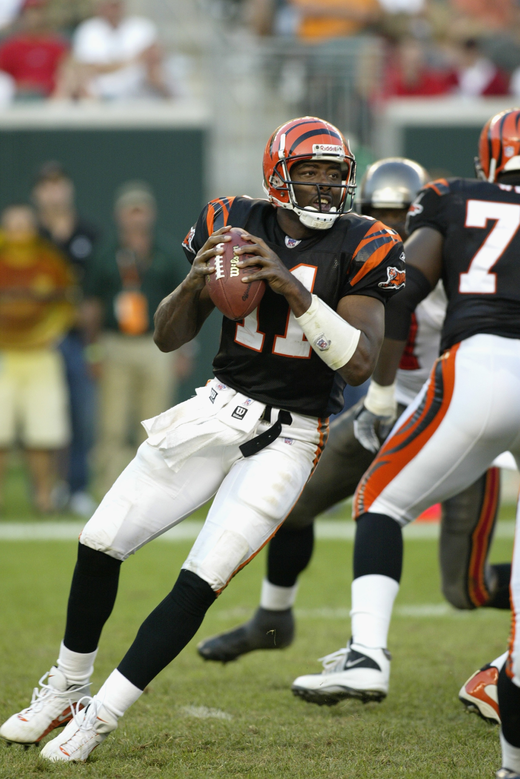 CINCINNATI - SEPTEMBER 29:  Quarterback Akili Smith #11 of the Cincinnati Bengals drops back to pass during the NFL game against the Tampa Bay Buccaneers on September 29, 2002 at Paul Brown Stadium in Cincinnati, Ohio.  The Buccaneers won 35-7. (Photo by