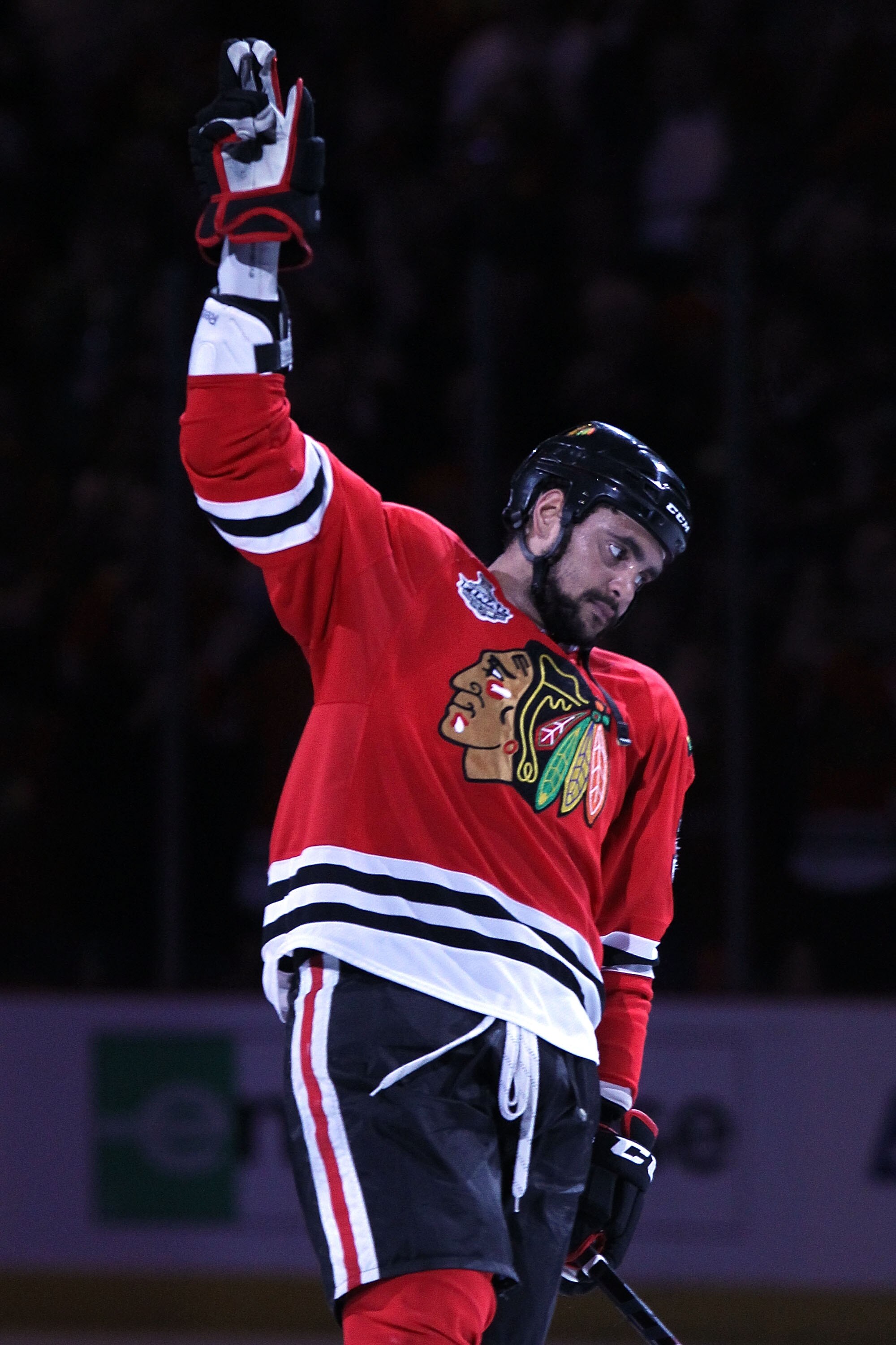 CHICAGO - JUNE 06:  Dustin Byfuglien #33 of the Chicago Blackhawks celebrates after scoring the game-winning goal to defeat the Philadelphia Flyers 7-4 in Game Five of the 2010 NHL Stanley Cup Final at the United Center on June 6, 2010 in Chicago, Illinoi
