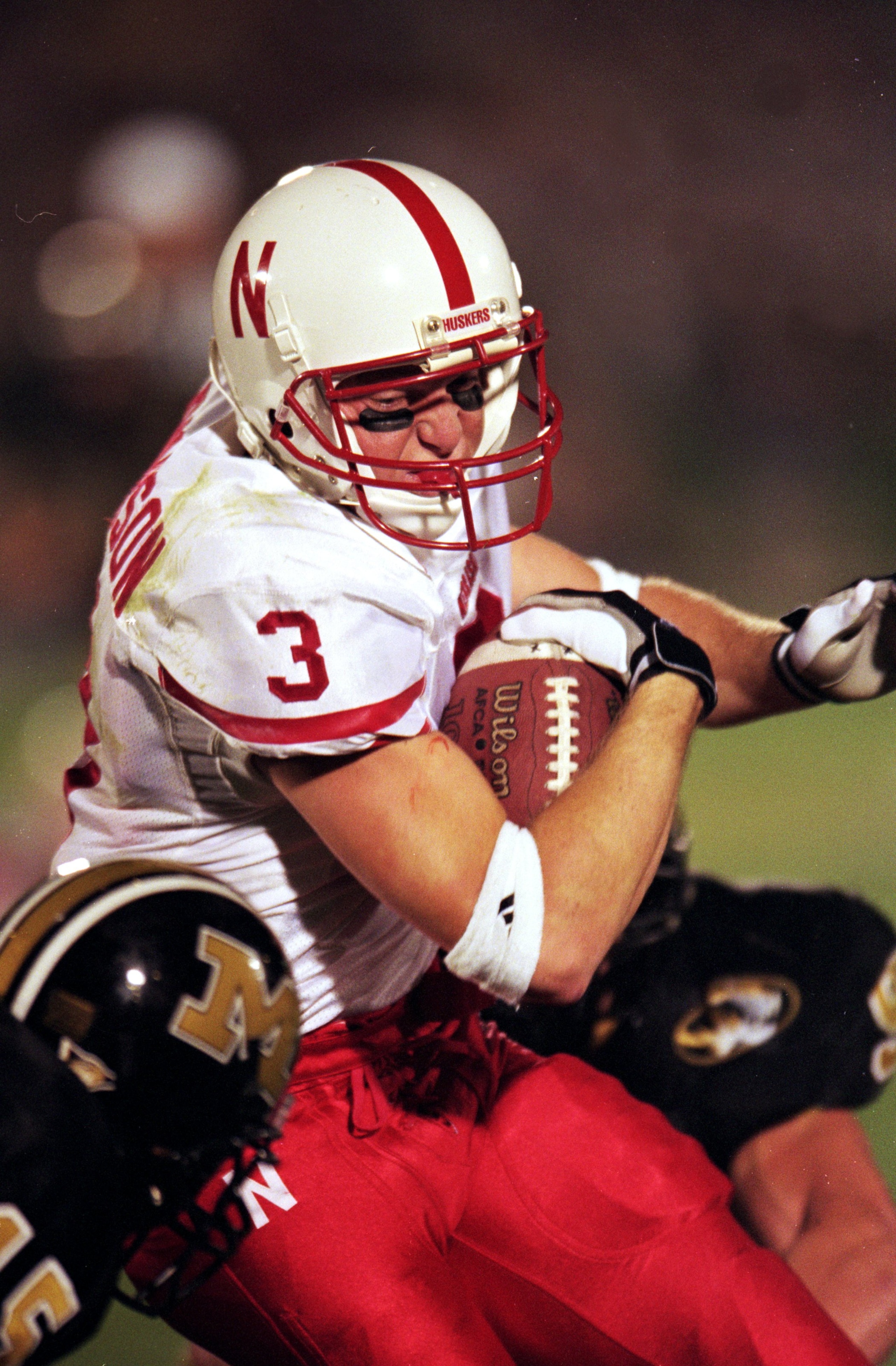 25 Sep 1999:  Matt Davison #3 of the Nebraska Cornhuskers carries the ball as he is tackled during the game against the Missouri Tigers at Faurot Field in Columbia, Mossouri. The Cornhuskers defeated the Tigers  41-21. Mandatory Credit: Elsa Hasch  /Allsp