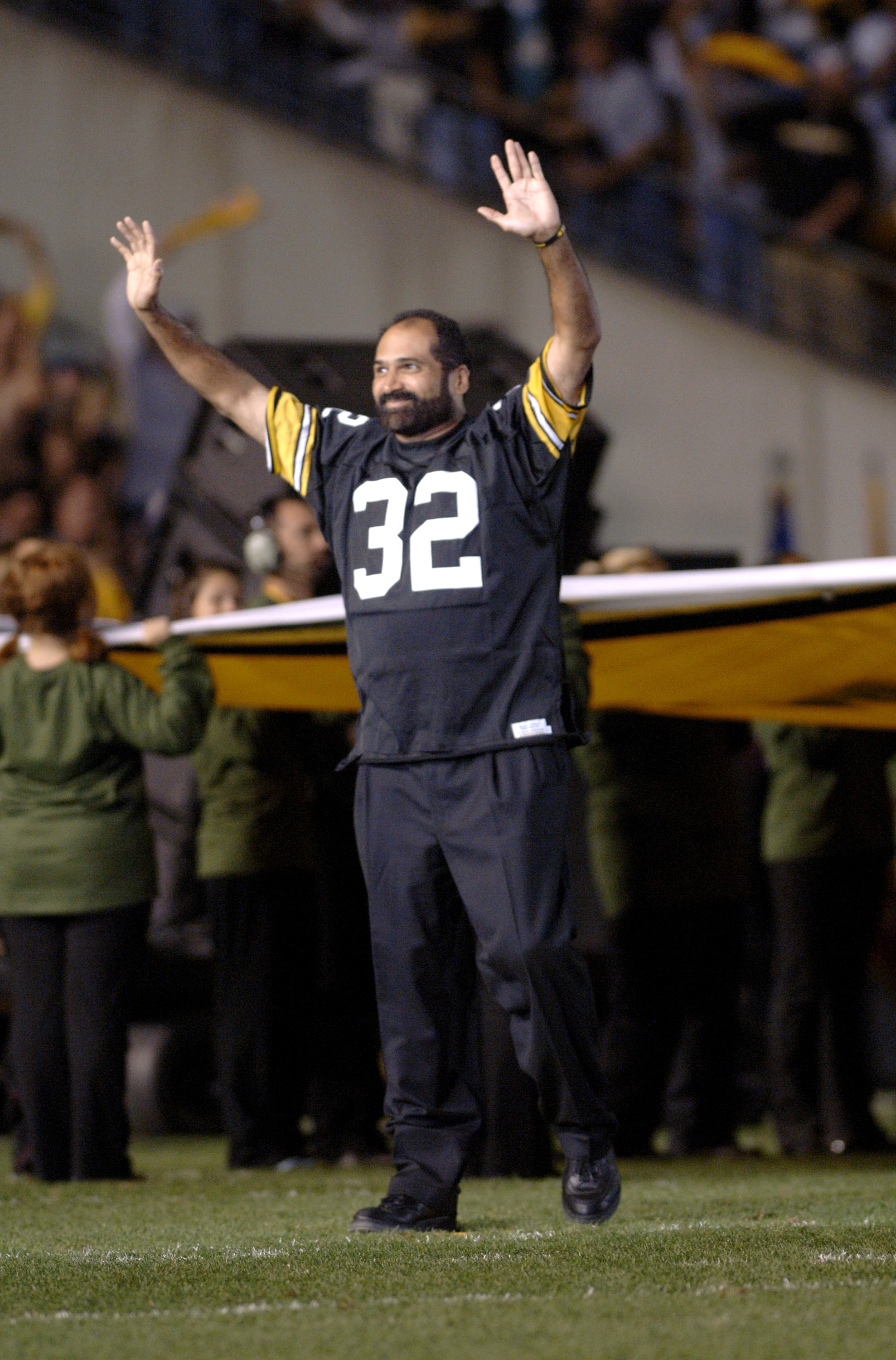Retired Pittsburgh Steelers running back Franco Harris on the field before the NFL's 2006 opening game against the Miami Dolphins on September 7, 2006 at Heinz Field in Pittsburgh, Pennsylvania.  The Steelers won 28 - 17.  (Photo by Al Messerschmidt/Getty