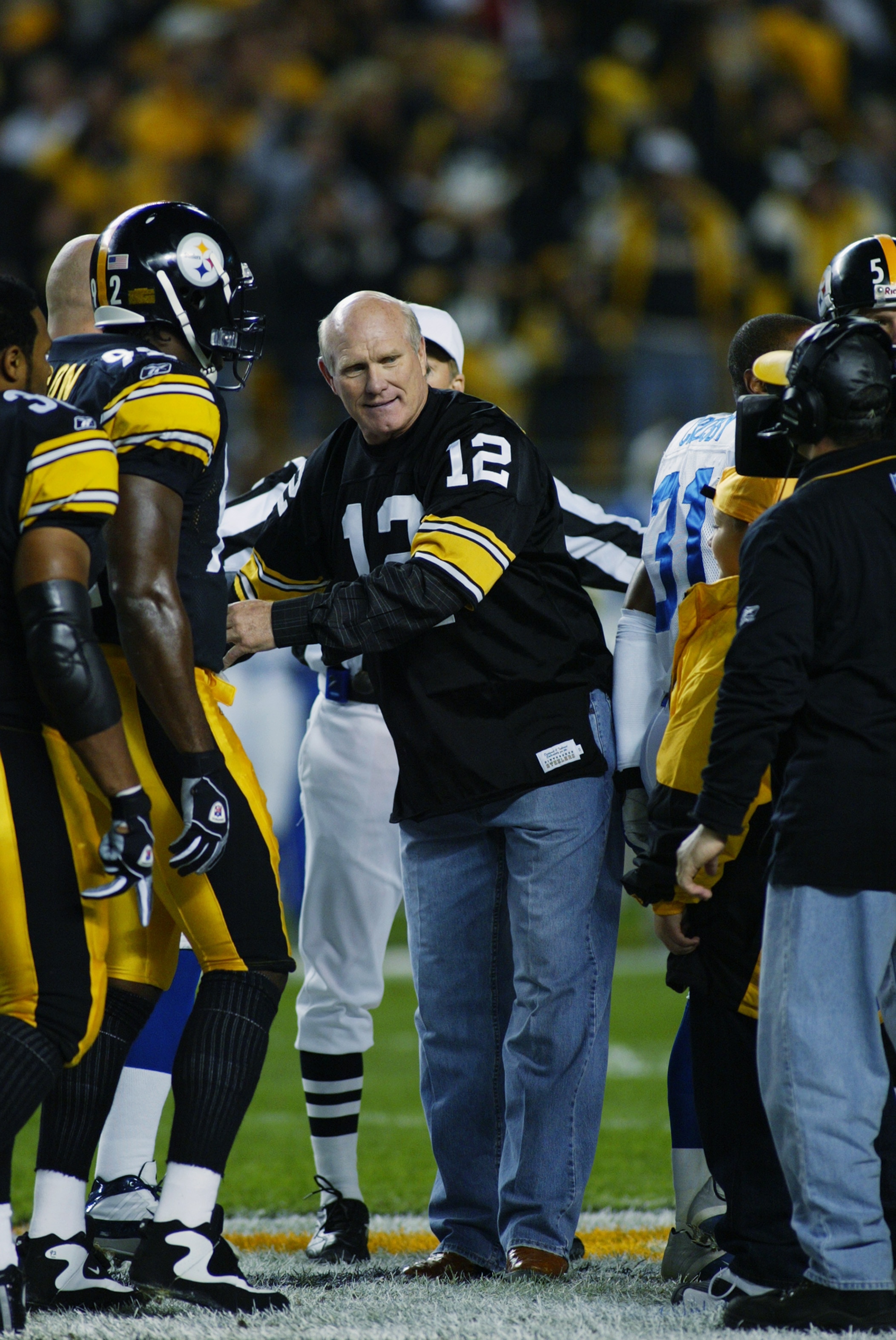 PITTSBURGH, PA - OCTOBER 21:   Retired Quarterback Terry Bradshaw #12 of the Pittsburgh Steelers hangs out with the team during the NFL game against the Indianapolis Colts at Heinz Field on October 21, 2002 in Pittsburgh, Pennsylvania. Pittsburgh won 28-1