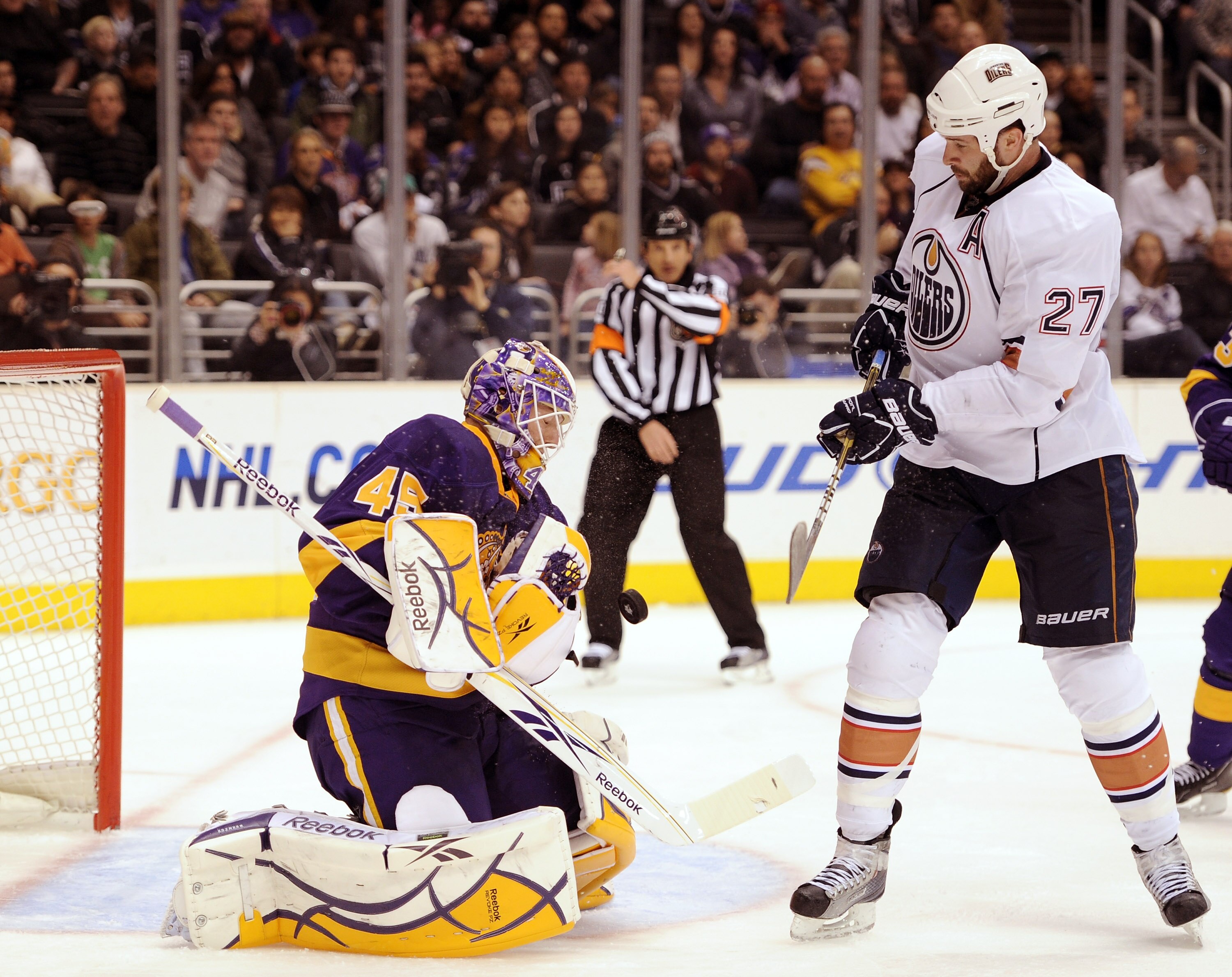 LOS ANGELES, CA - JANUARY 15:  Jonathan Bernier #45 of the Los Angeles Kings makes a save as Dustin Penner #27 of the Edmonton Oilers waits for a rebound during a 5-2 Kings win at the Staples Center on January 15, 2011 in Los Angeles, California.  (Photo