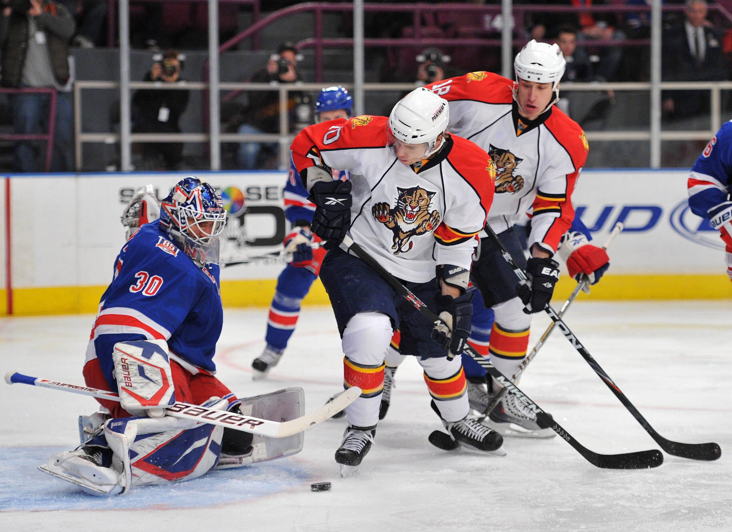 NEW YORK, NY - JANUARY 25: David Booth #10 of the Florida Panthers watches Henrik Lundqvist #30 of the New York Rangers deflect his shot on goal during the first period at Madison Square Garden on January 25, 2011 in New York City. (Photo by Christopher P