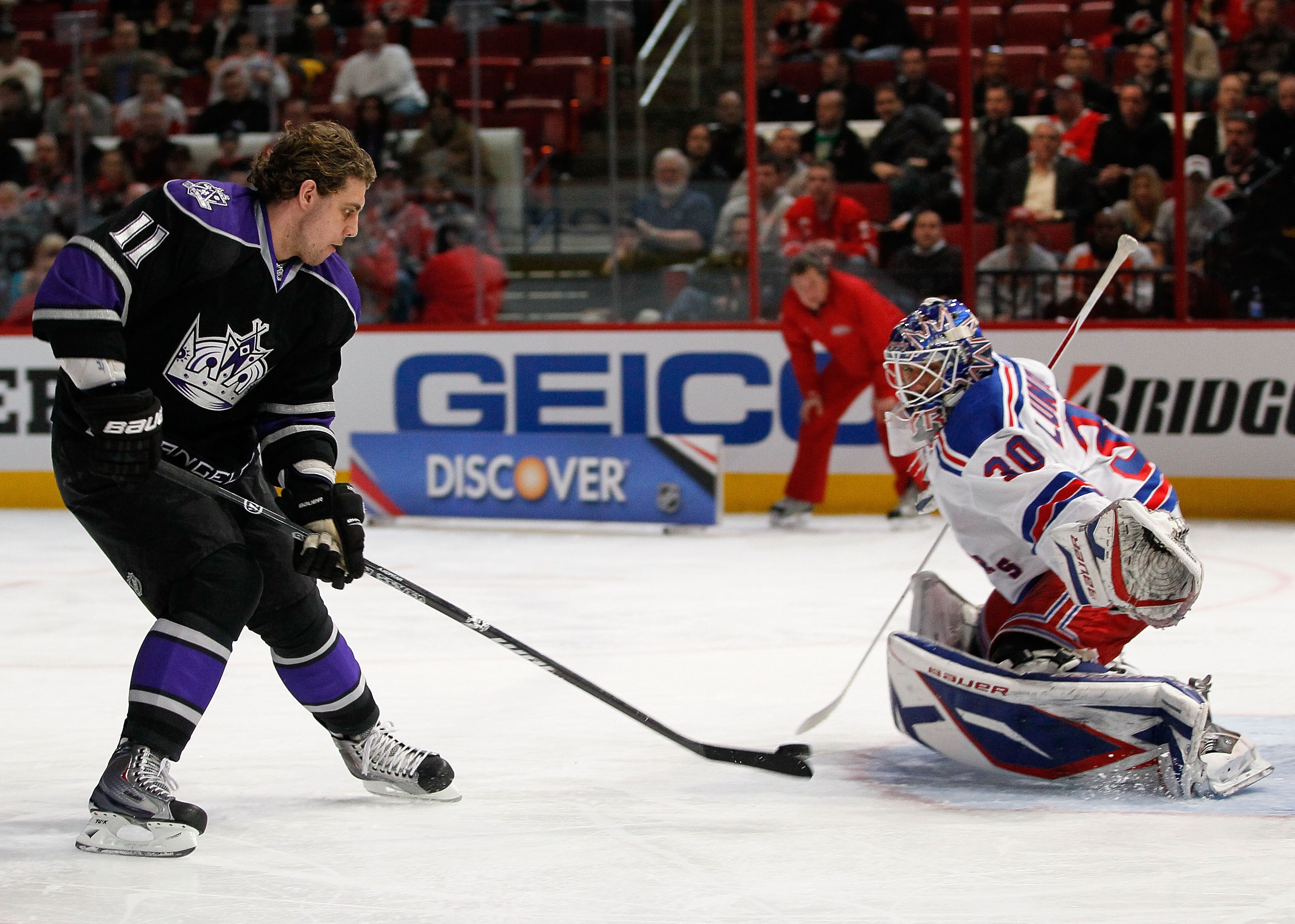 RALEIGH, NC - JANUARY 29:  Anze Kopitar #11 of the Los Angeles Kings shoots on Henrik Lundqvist #30 of New York Rangers during the elimination shootout in the Honda NHL SuperSkills competition part of 2011 NHL All-Star Weekend at the RBC Center on January