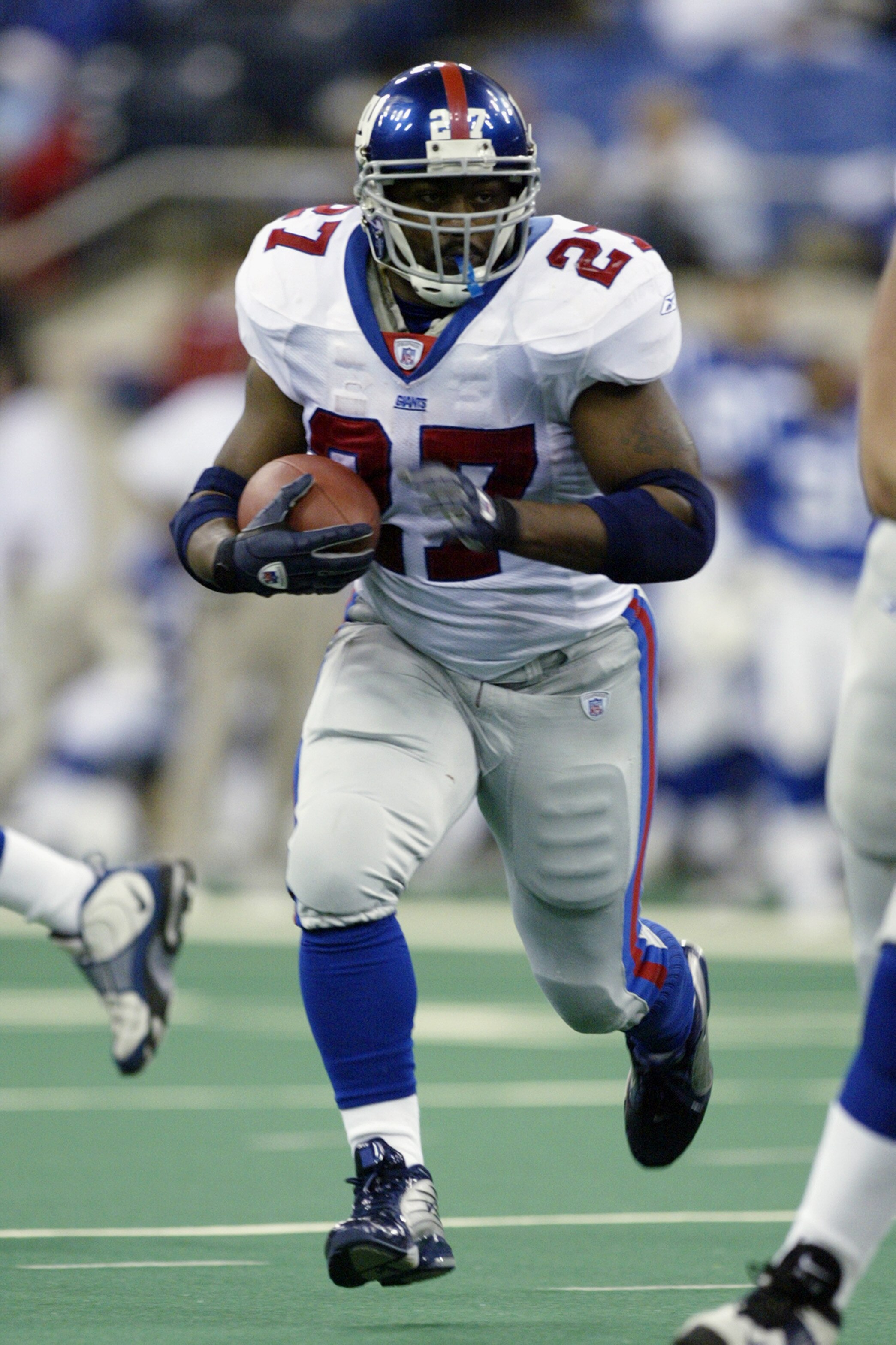 INDIANAPOLIS - DECEMBER 22:  Ron Dayne #27 of the New York Giants carries the ball against the Indianapolis Colts during the NFL game on December 22, 2002 at the RCA Dome in Indianapolis, Indiana.  The Giants defeated the Colts 44-27.  (Photo by Jeff Gros